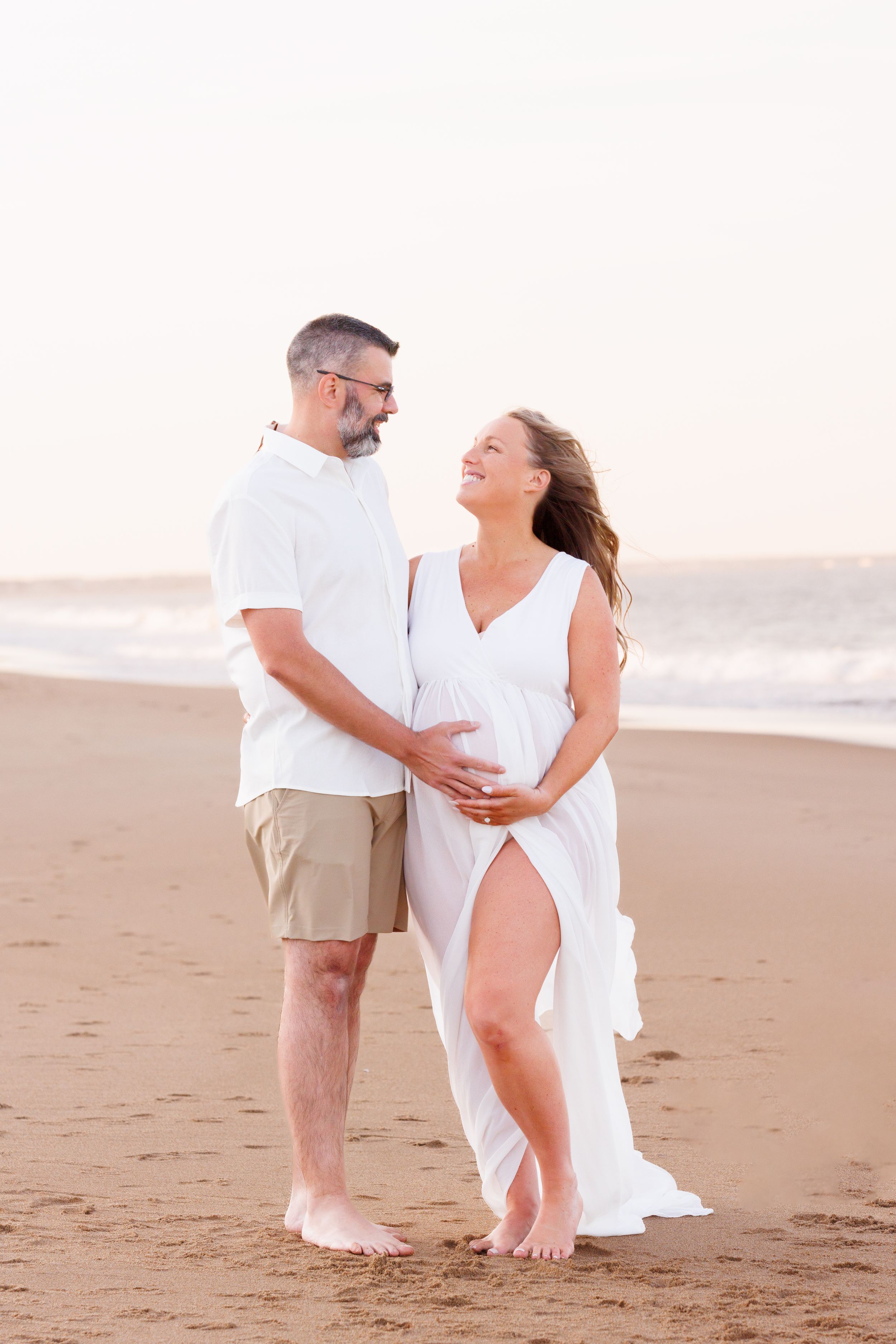 Expecting mother posing during a golden hour beach maternity photography session