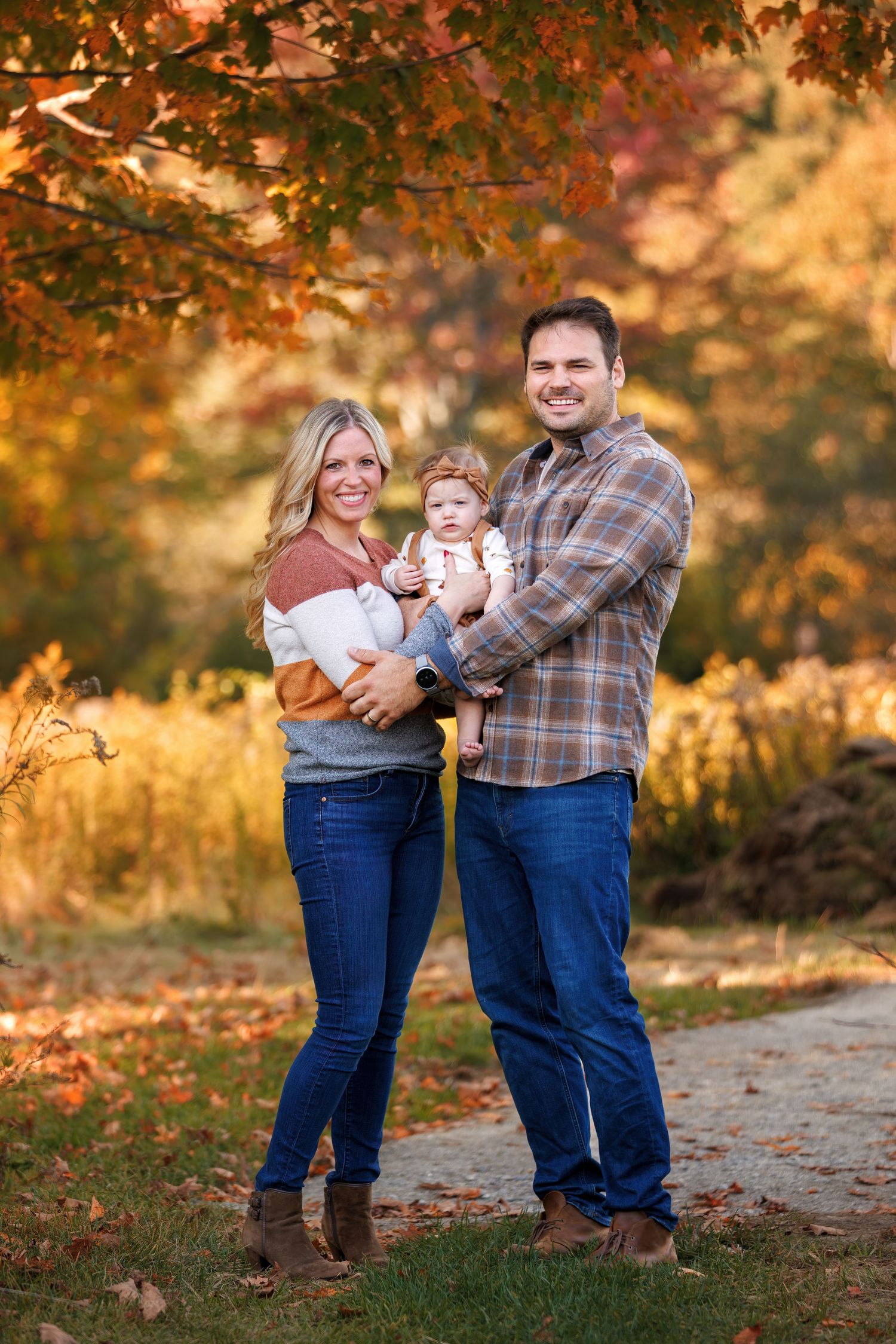 Family portrait sequence showing joyful interactions between parents and child on a fall day with golden foliage.