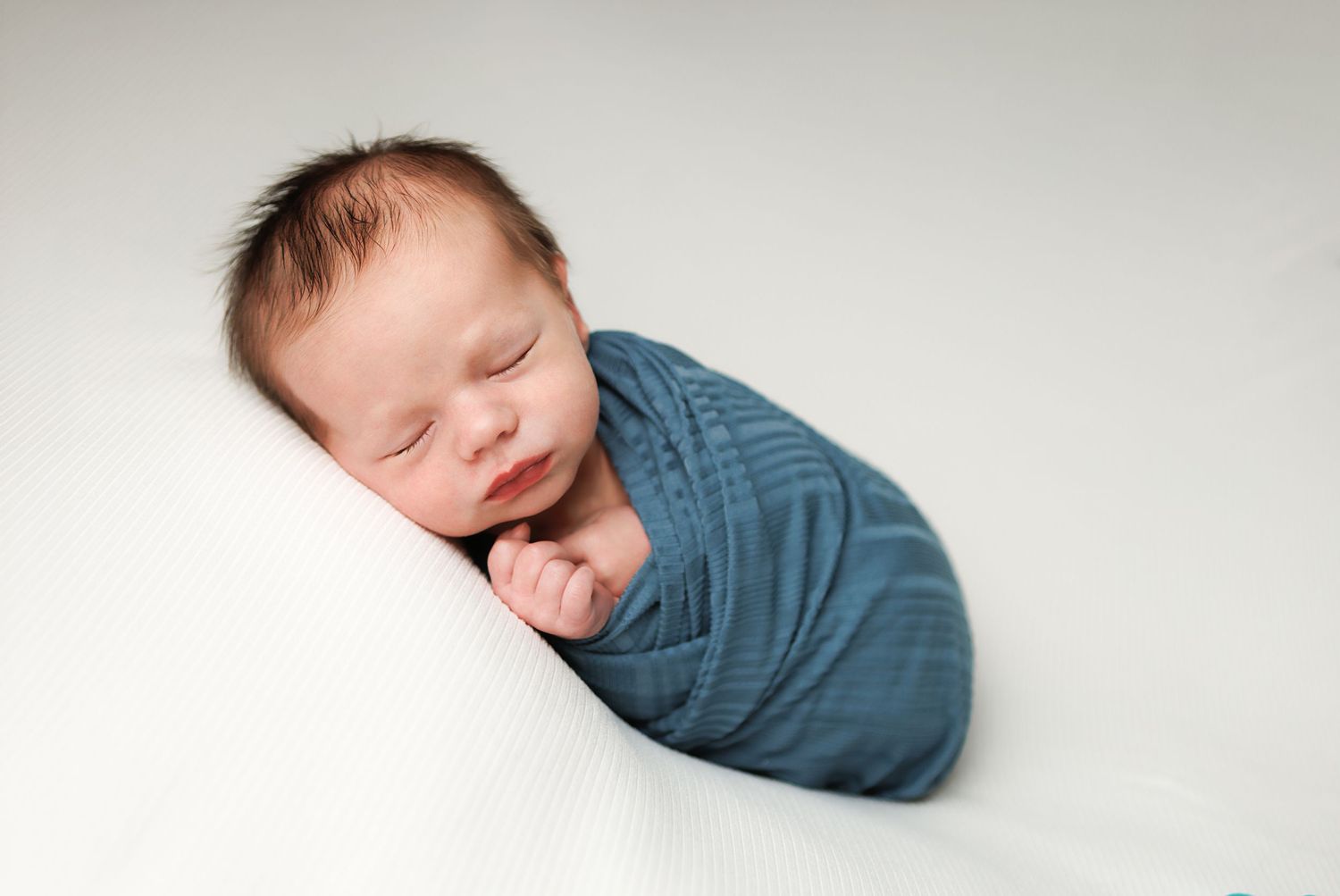 Custom newborn baby photography session serving families in Salem, Windham, Londonderry, and Derry, New Hampshire