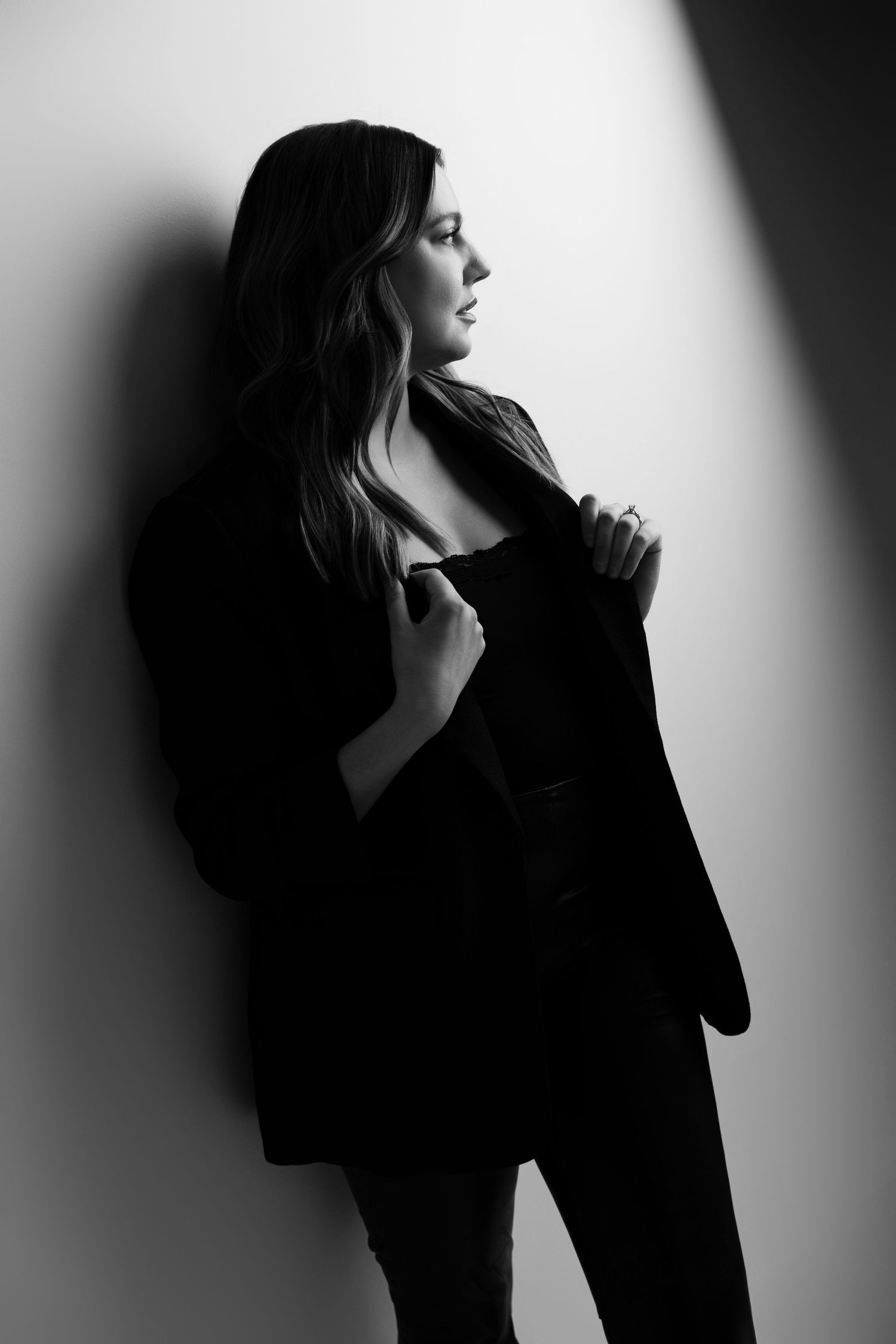 Dramatic silhouette portraits with strong contrast between light and shadow.