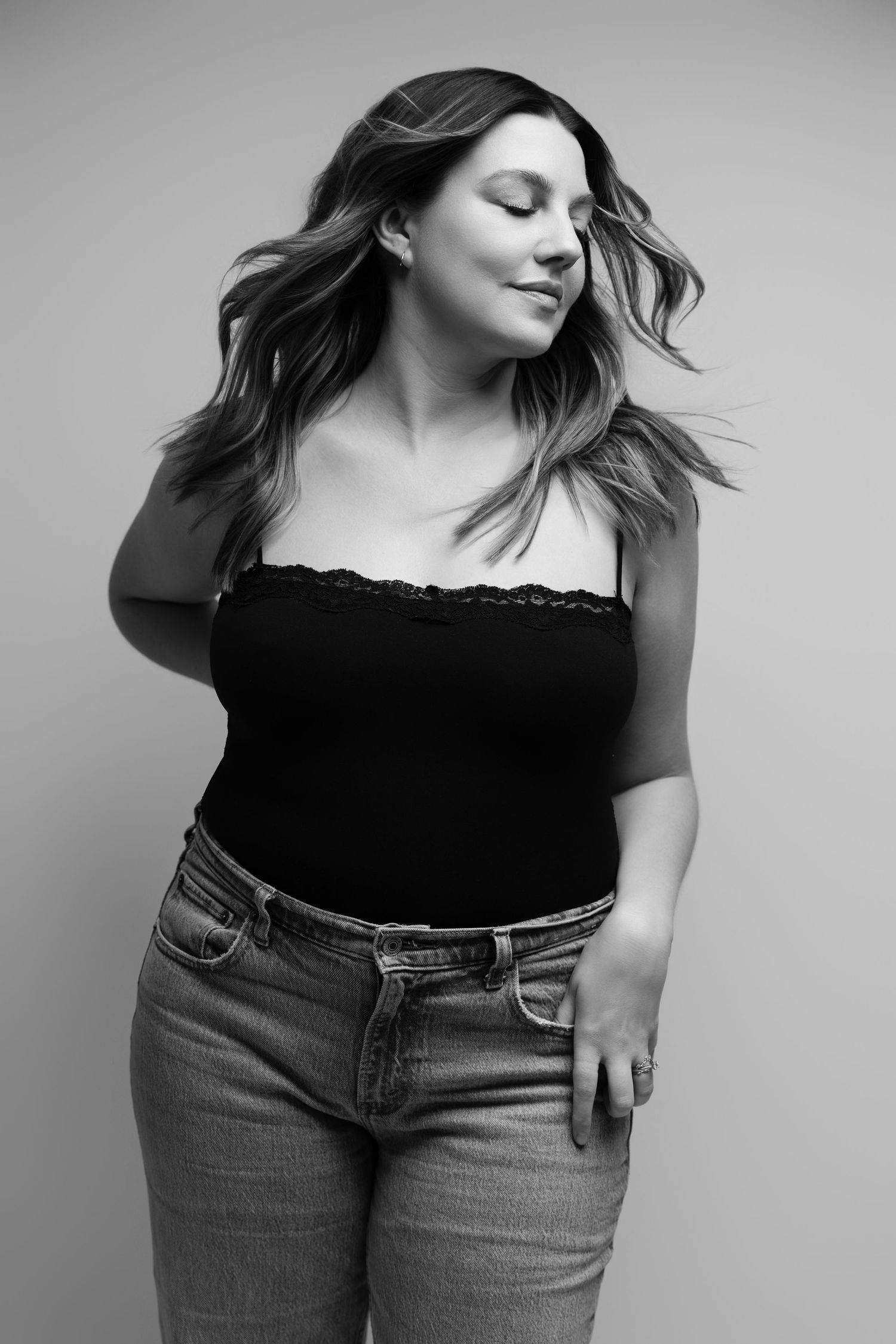 Fashion portraits featuring casual style with black top and denim against light background.