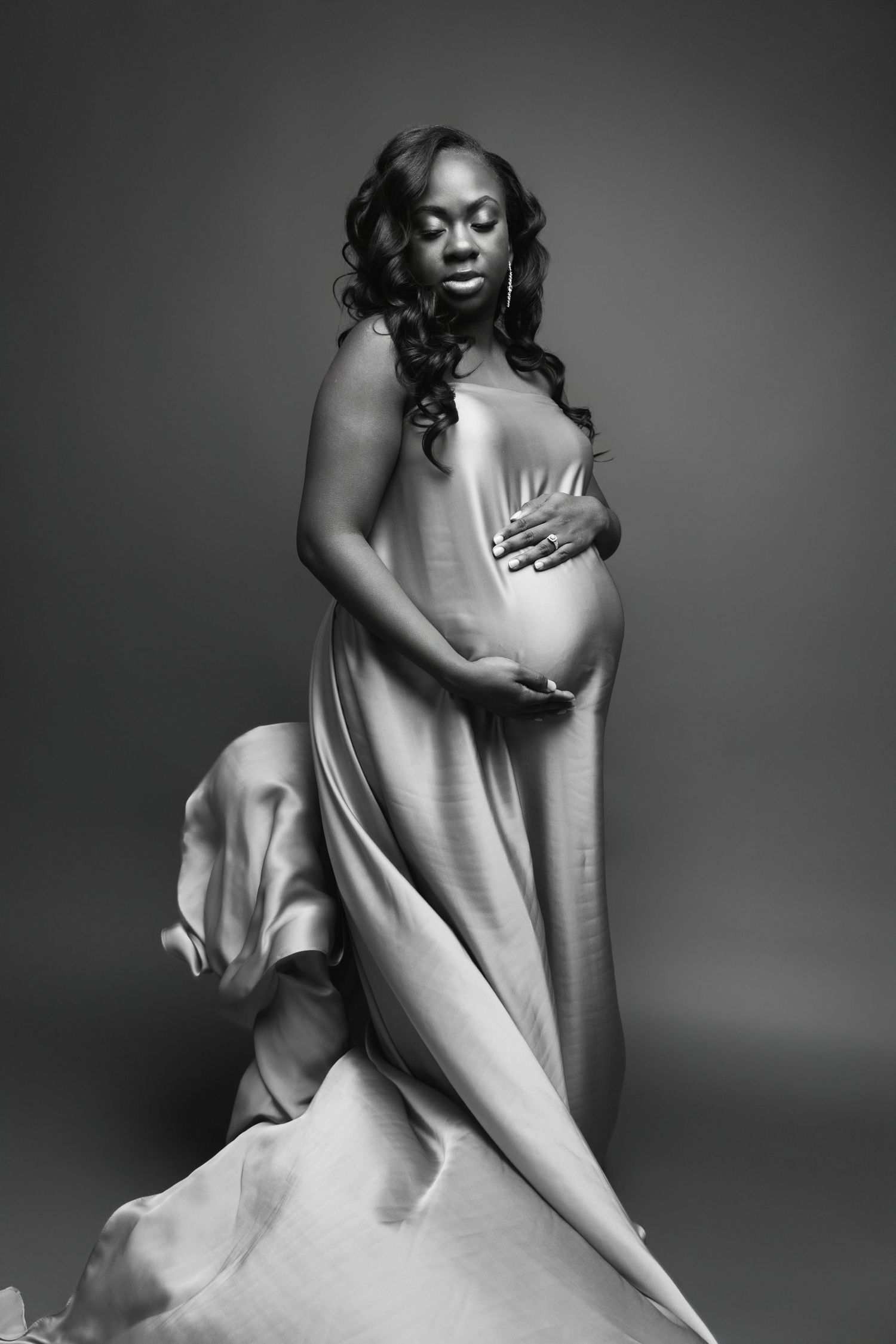black and white portrait of a pregnant woman captured by a Michigan maternity photographer