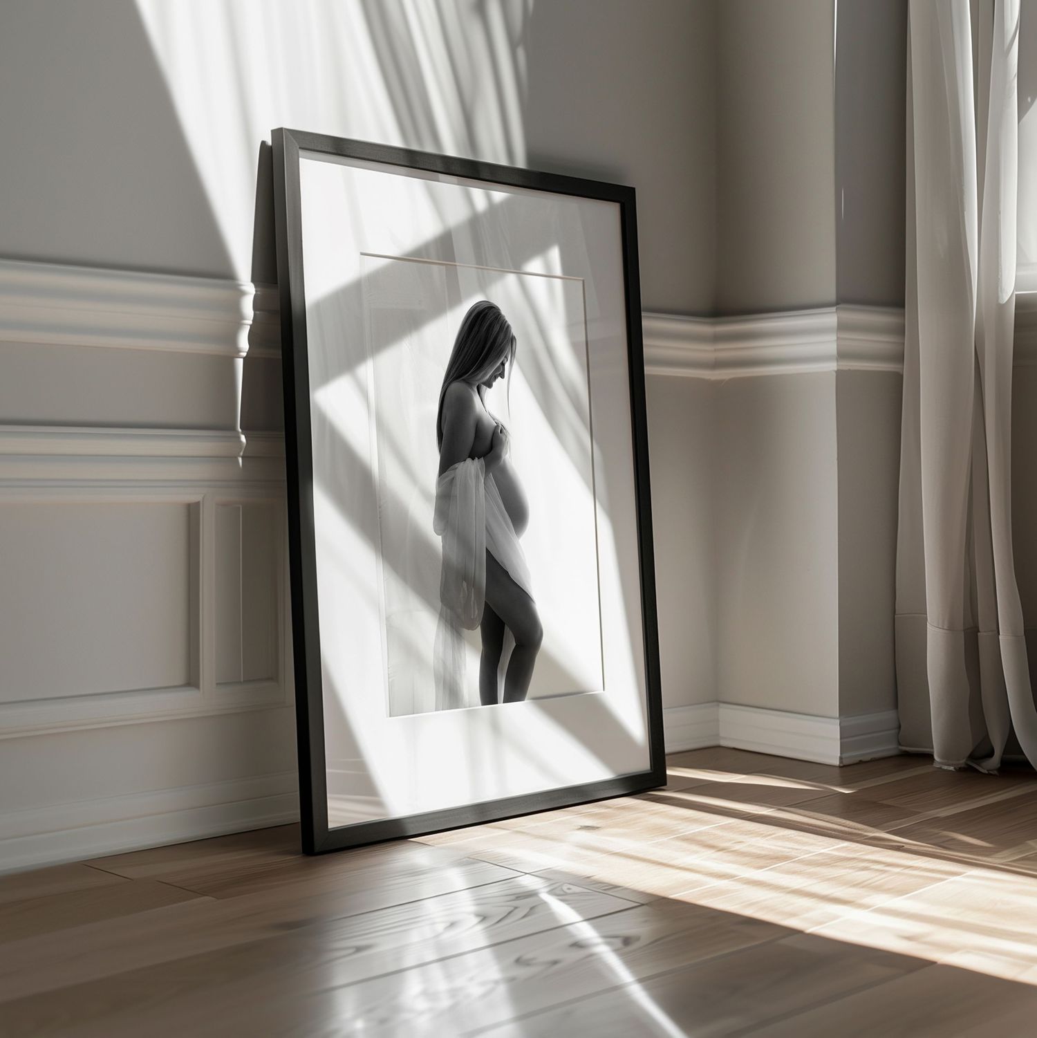Sunlit room with large framed artwork and dramatic window shadows on white walls.
