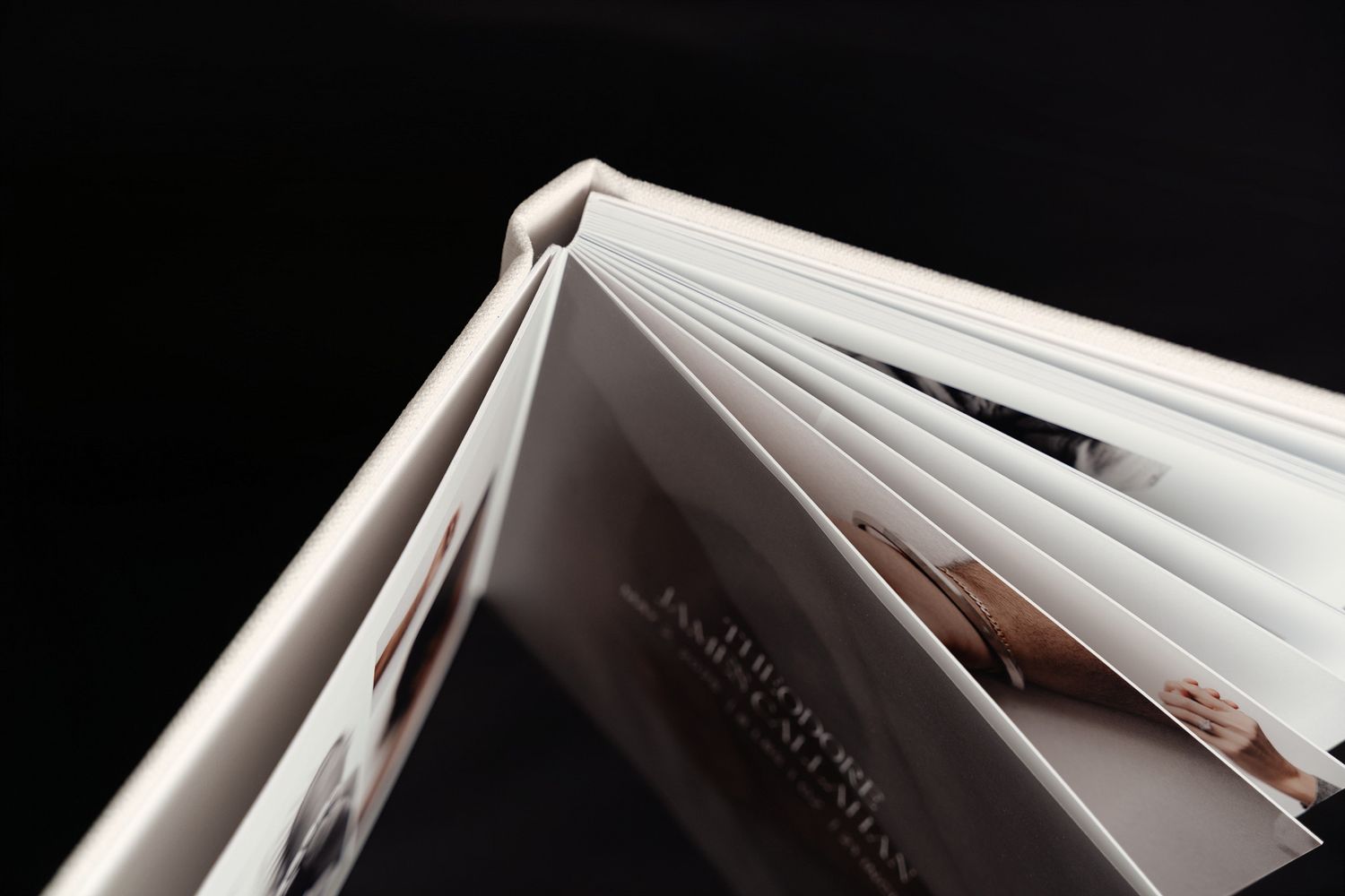 A sequence of seven black and white photos showing a book's pages being flipped in a fanning motion.