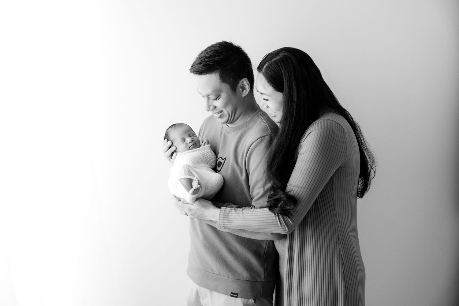 Black and white Michigan family photo in a studio