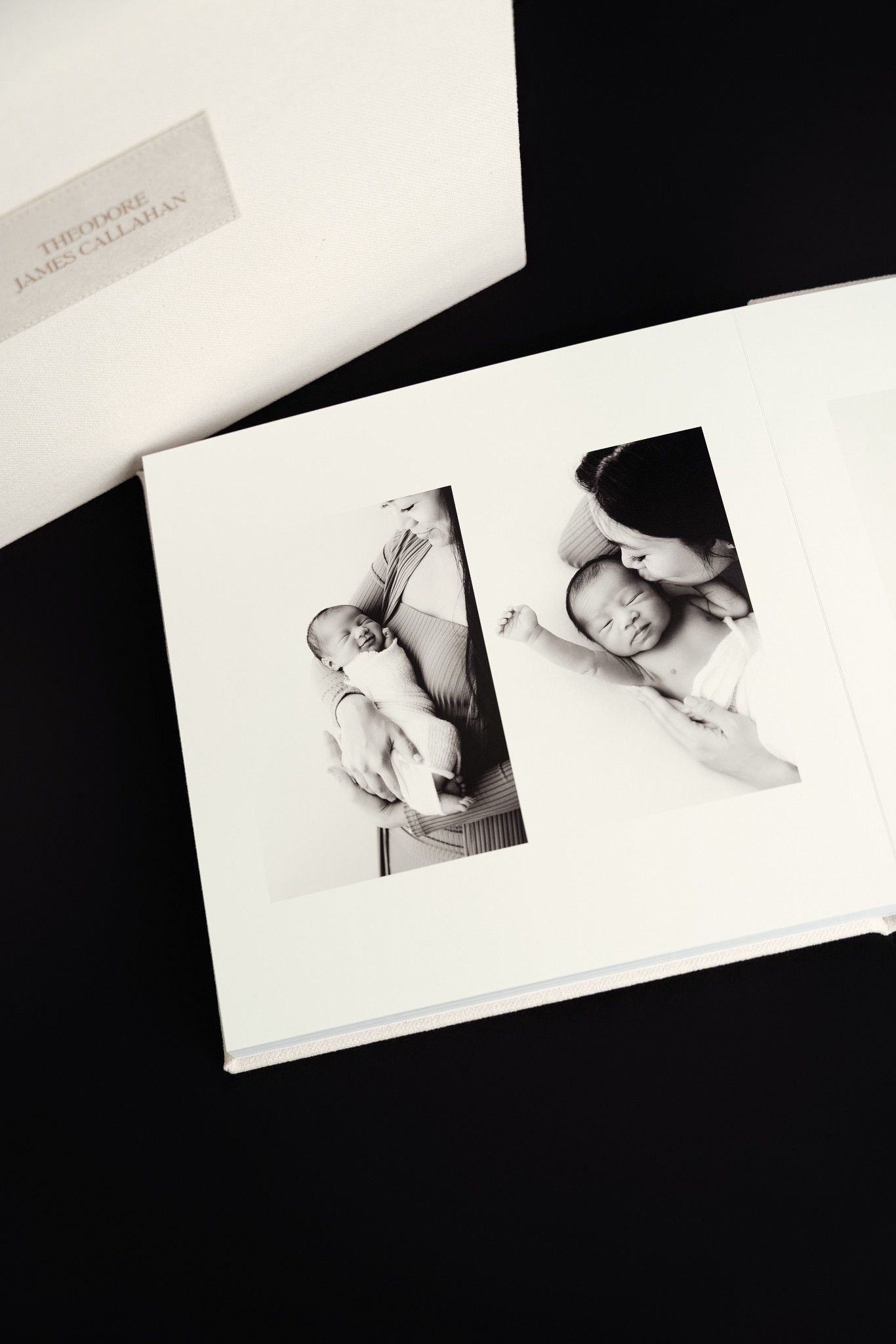 Minimalist black and white photo collage showing various angles of a baby in soft lighting against a white background.