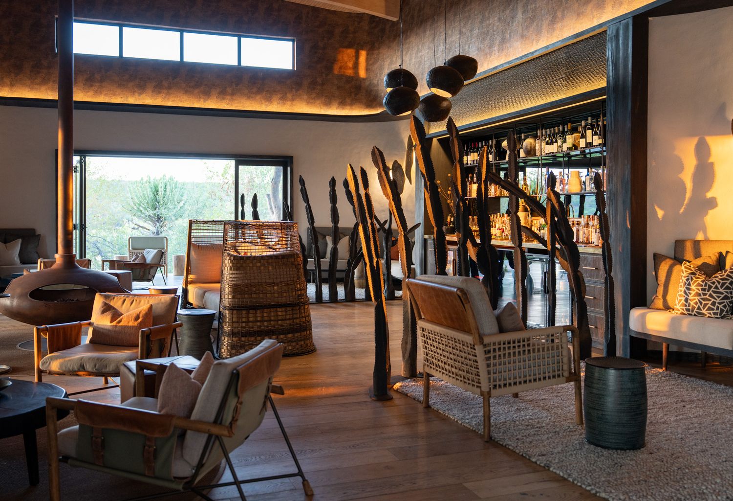 Modern lounge area with large windows offering panoramic views of the surrounding landscape.
