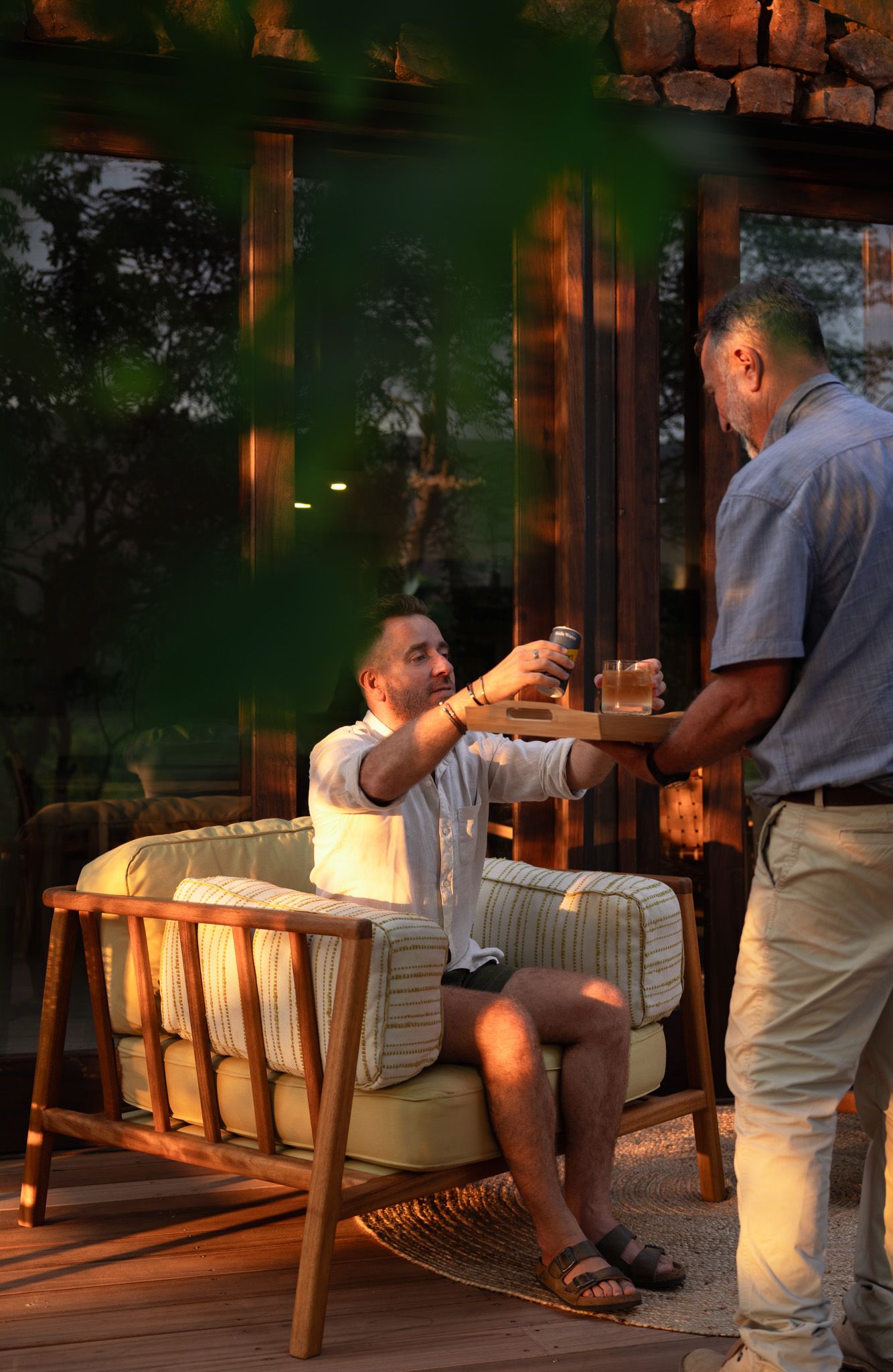 Evening dining service on outdoor patio with warm lighting.