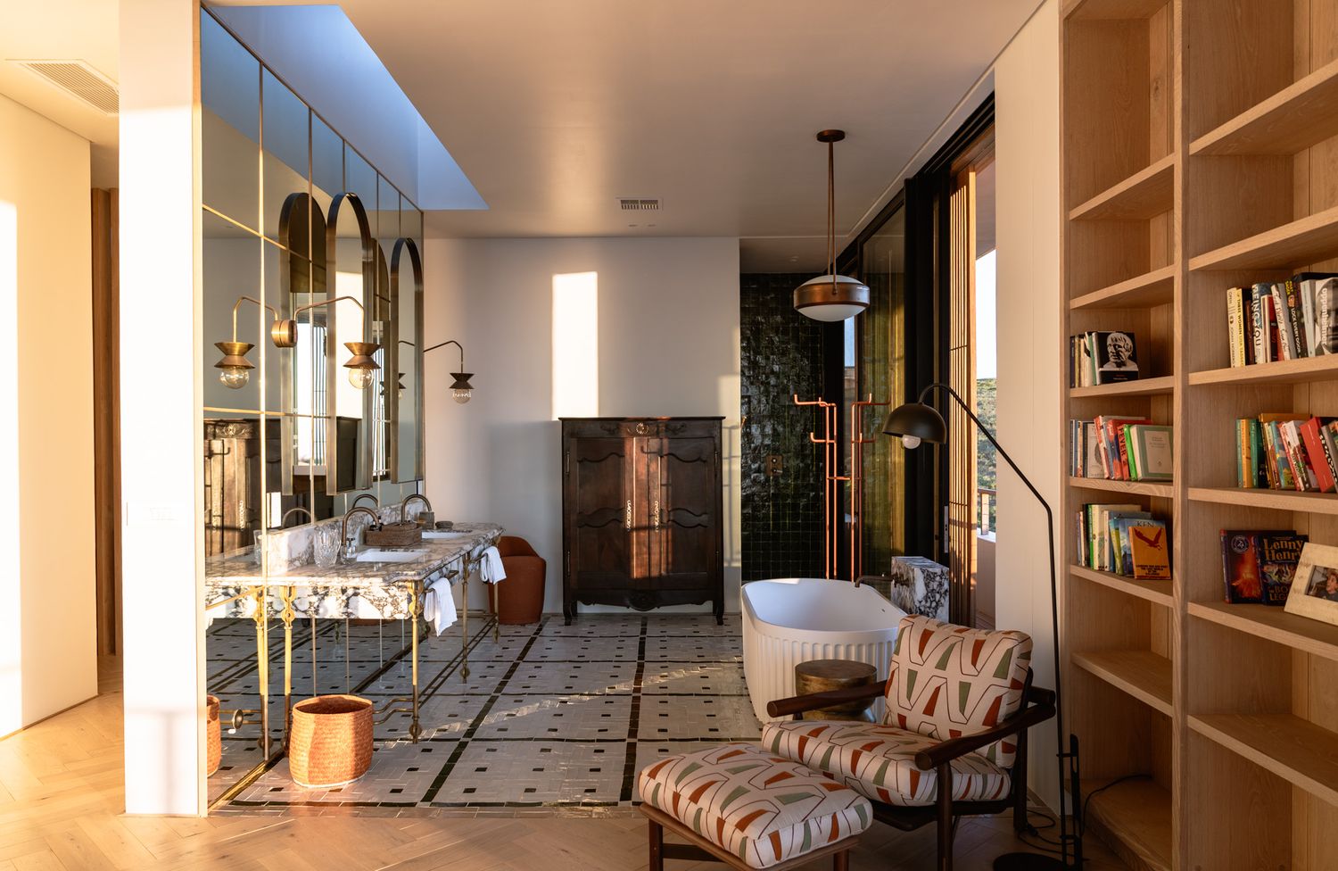 Modern interior space with built-in shelving and contemporary furnishings in natural light.