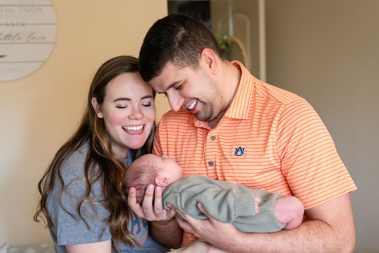 An intimate family photo moment in a home setting.