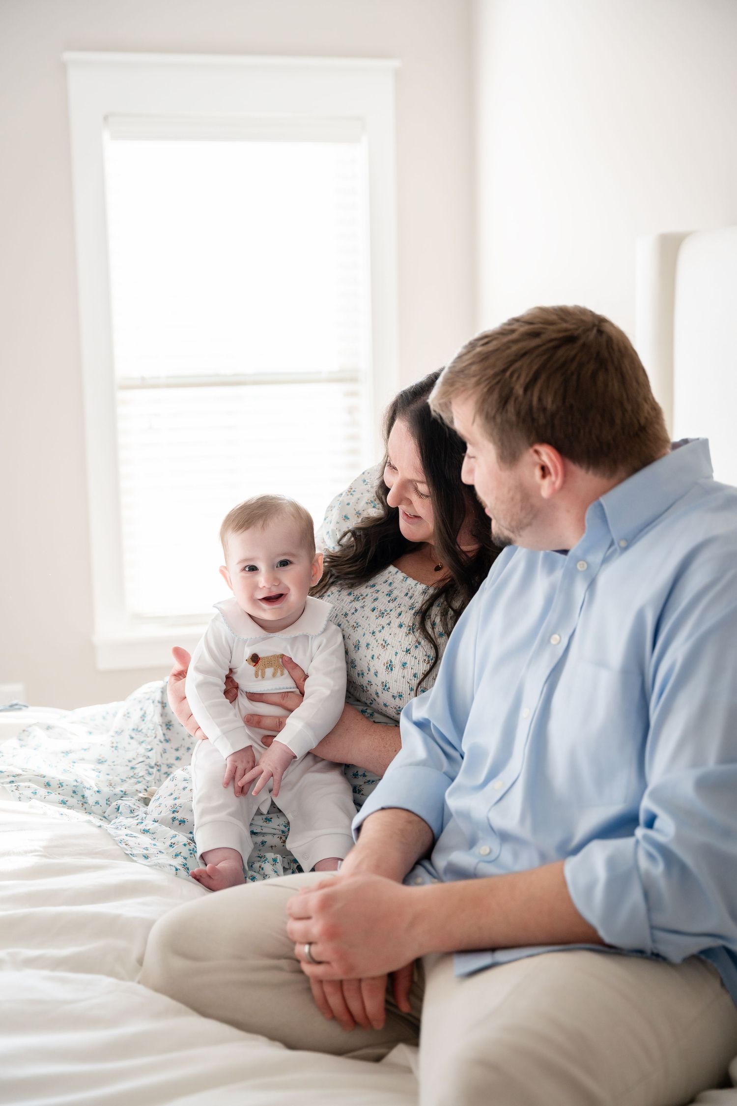 Sweet candid moment of family interaction during indoor photo session.