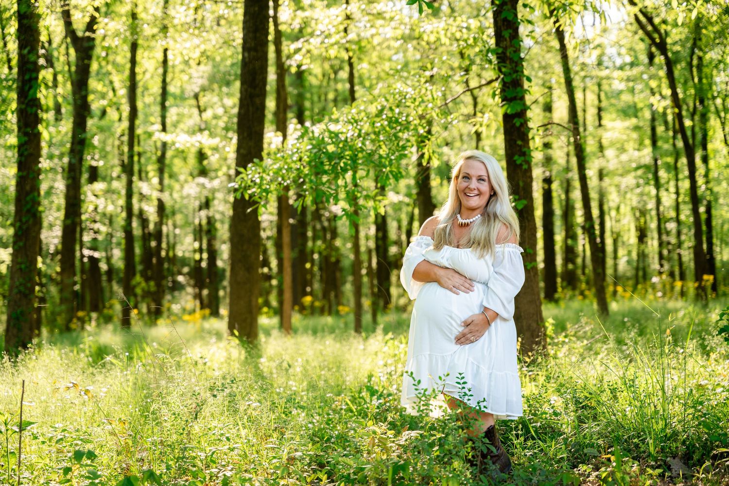 Natural woodland setting with sunlight filtering through trees for outdoor photography.
