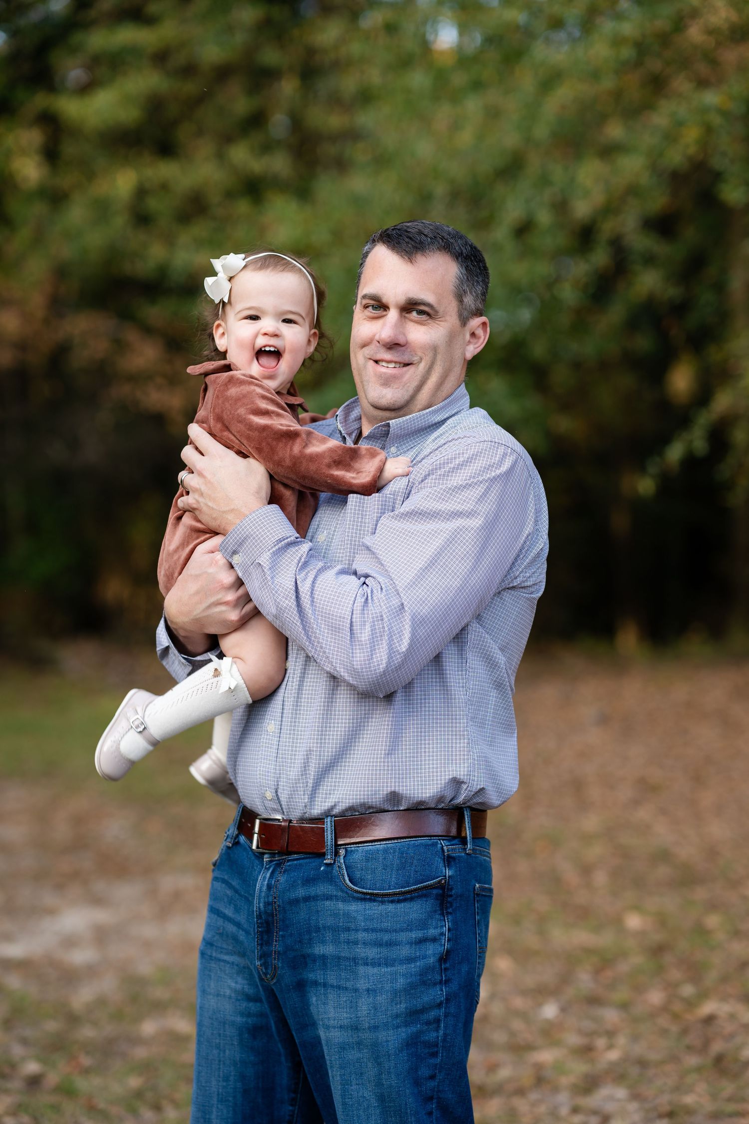 Fall outdoor portrait against a natural green background.