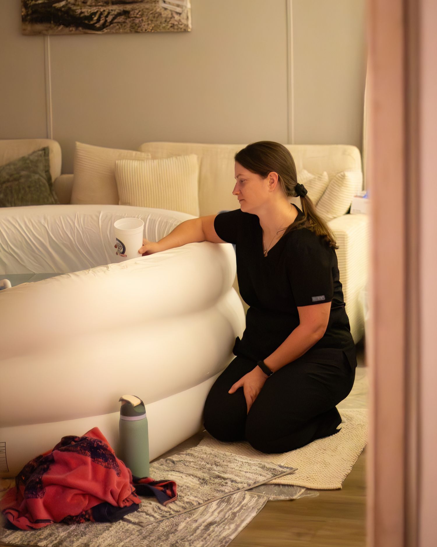 Midwife quietly watching labor at homebirth in Wise County