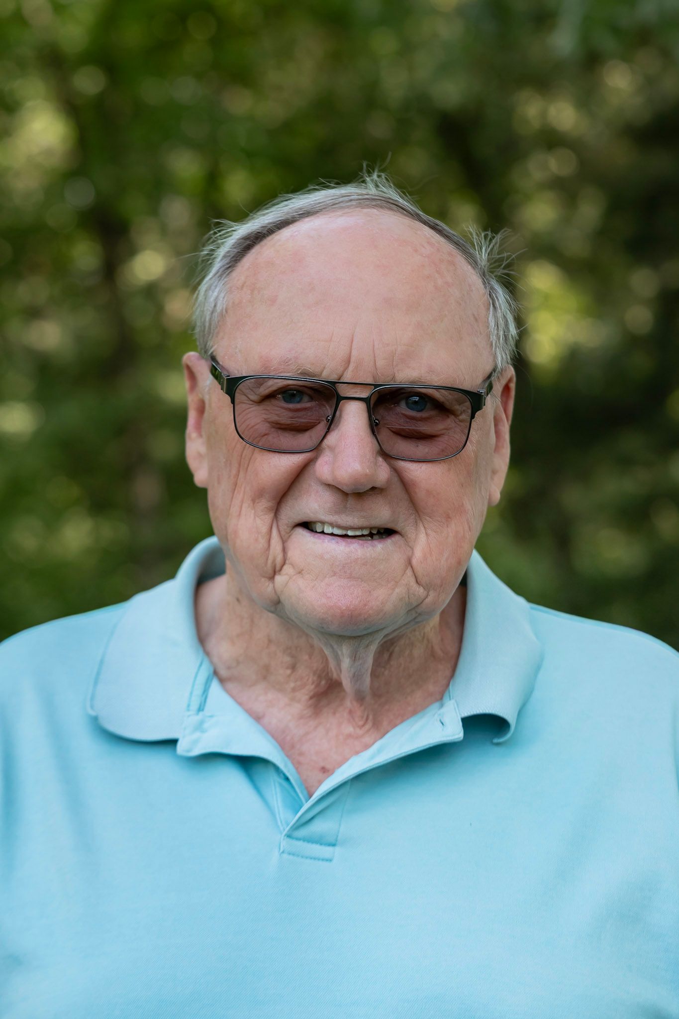 close up portrait of elderly man in an outdoor scenery