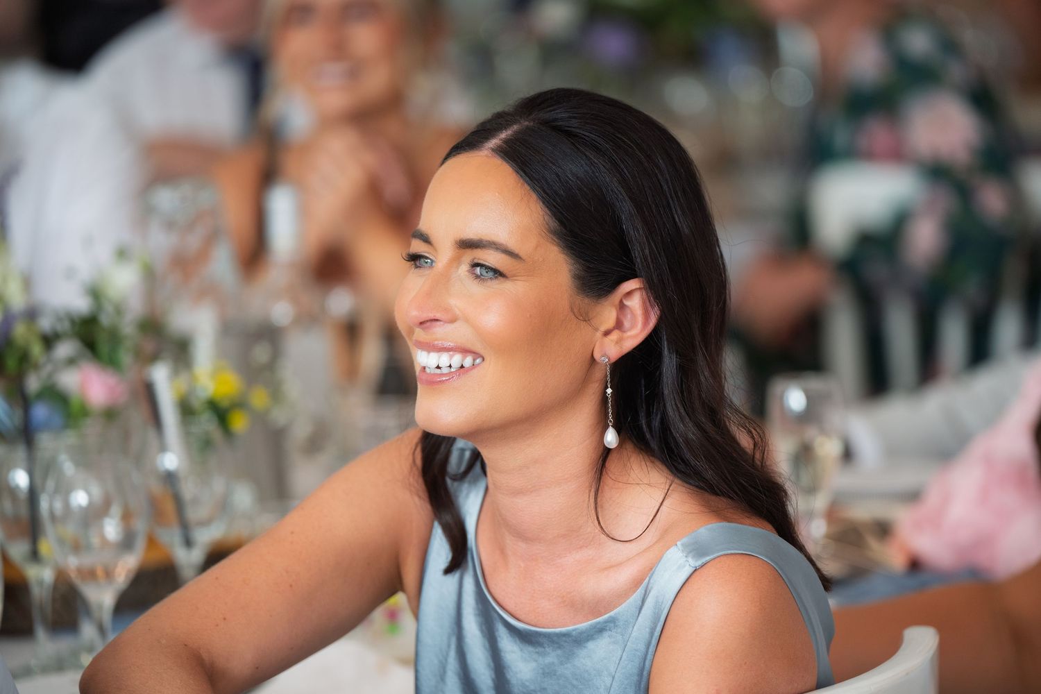 Beautiful bridesmaid beaming during hilarious speeches at Rowton Castle; authentic Shropshire wedding moments.