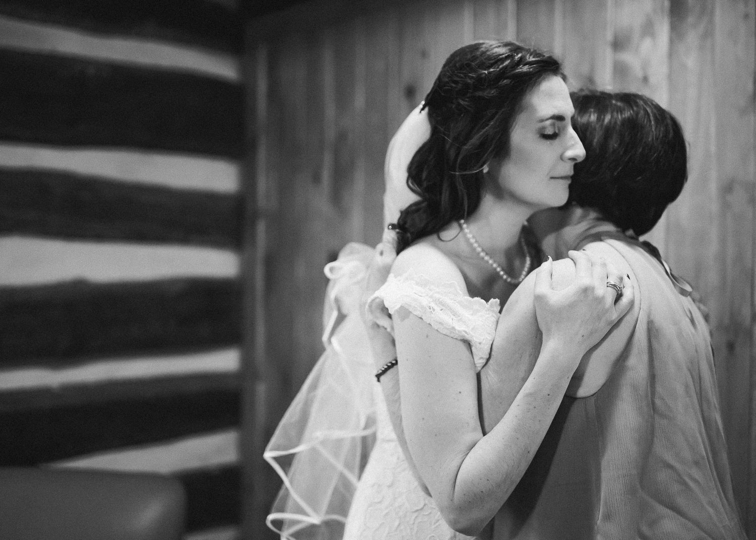 Mother of the bride and bride sharing an emotional moment before the wedding, at Cacapon State Resort, West Virginia