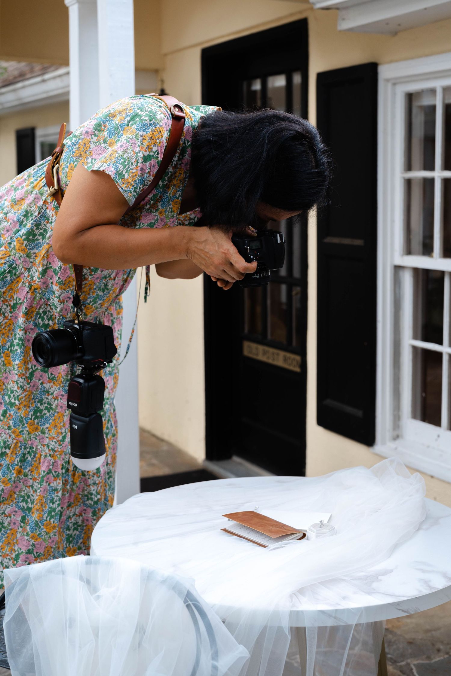 LUEM taking photos of wedding details at Airlie in Warrenton, Virginia