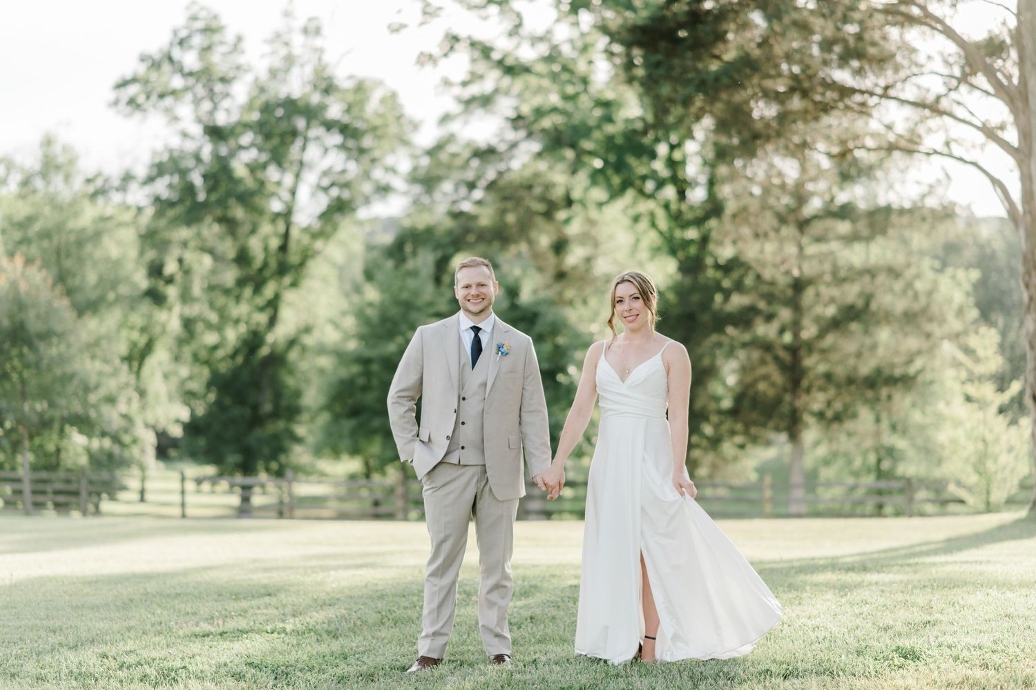 A couple standing in a field together- Vineyard Wedding- The Winery at Bull Run