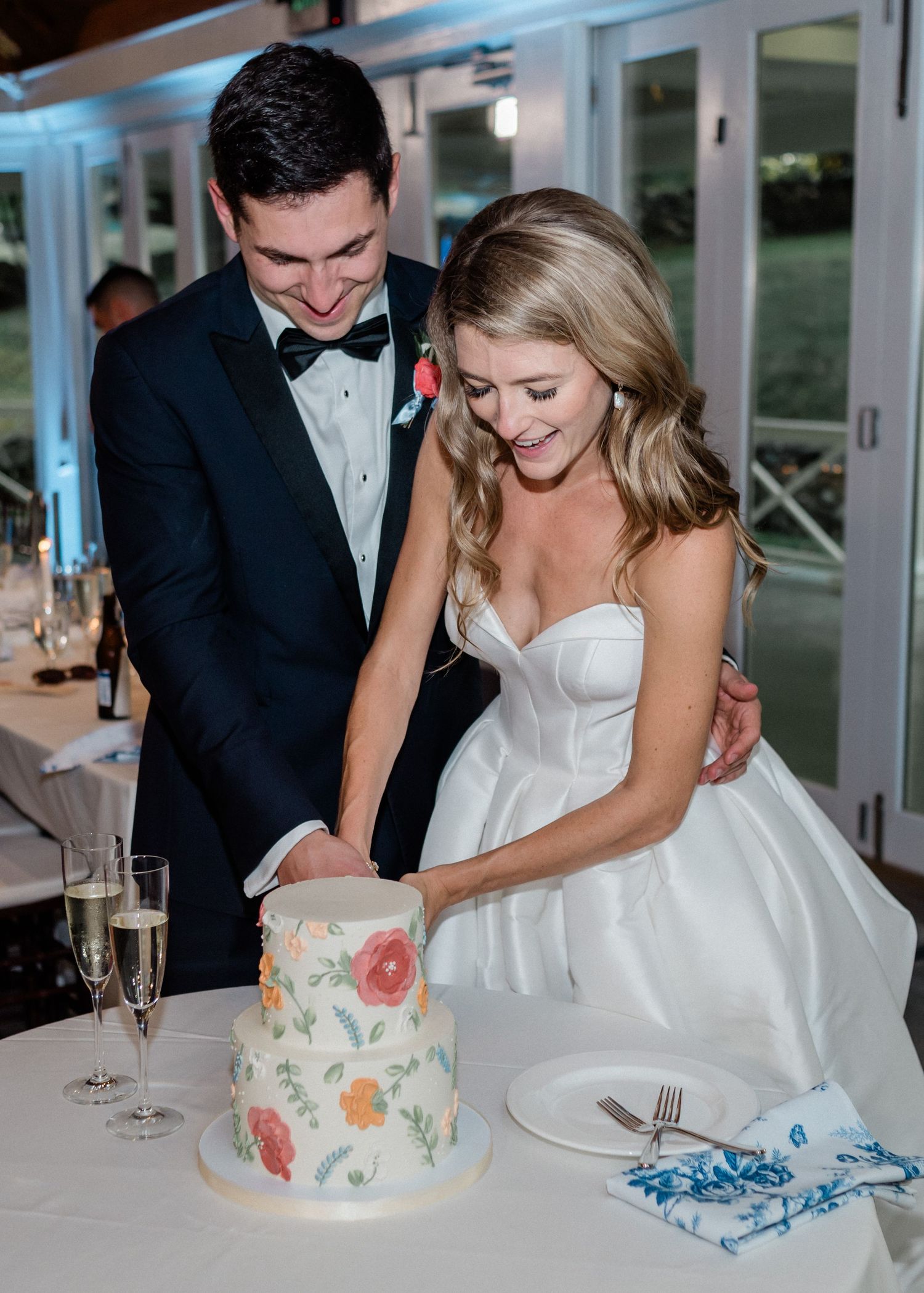Couple cutting their wedding cake at Airlie in Warrenton, Virginia.