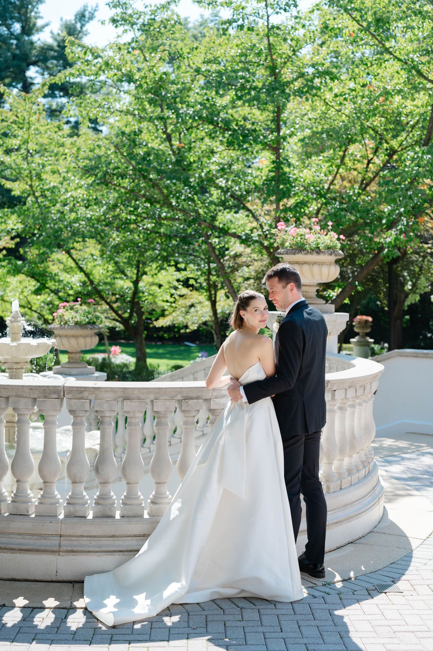 Bride and groom standing outside the Omni Shoreham Hotel, DC.