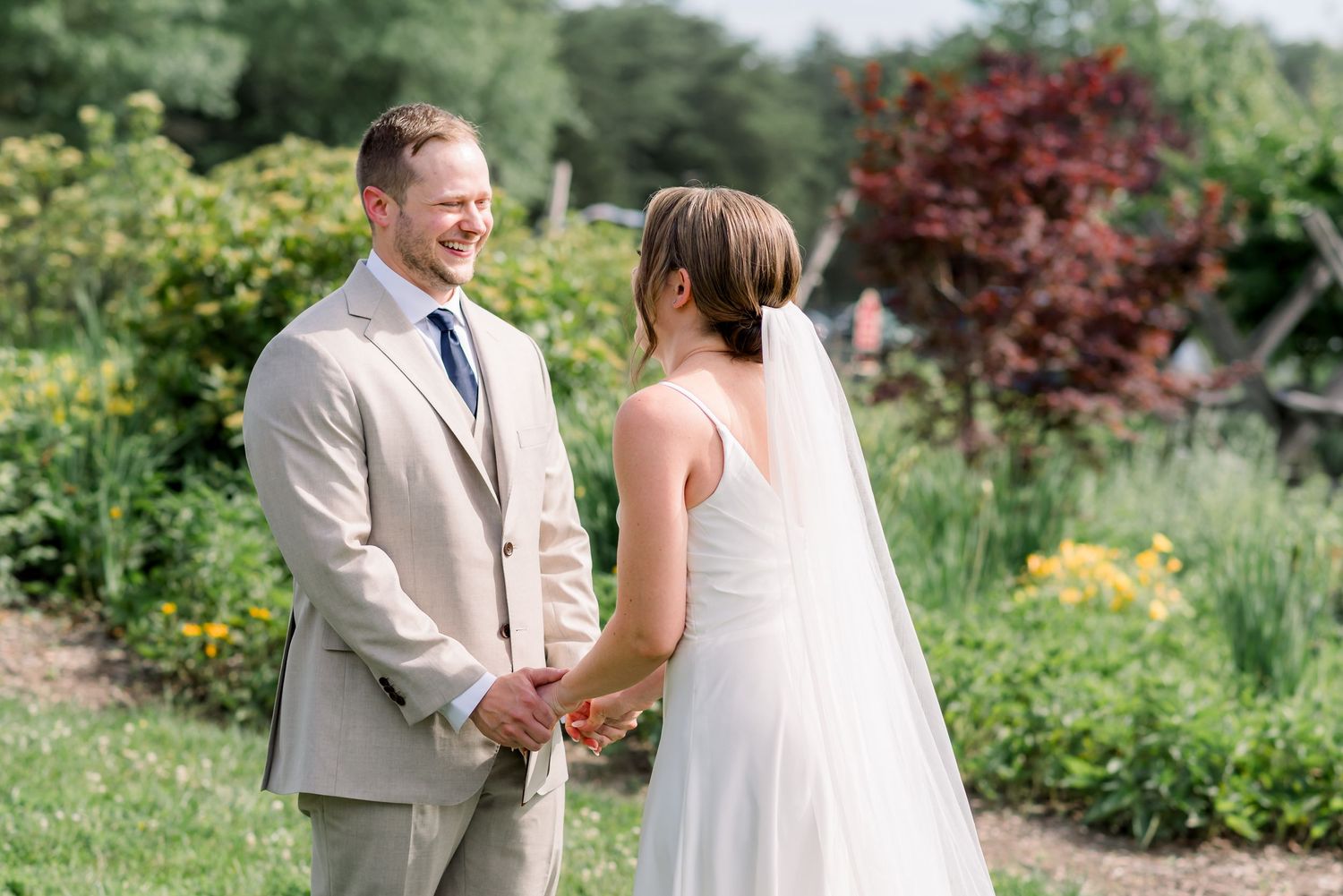 A first look moment between bride and groom at Bull Run Winery in Centreville, Virginia.