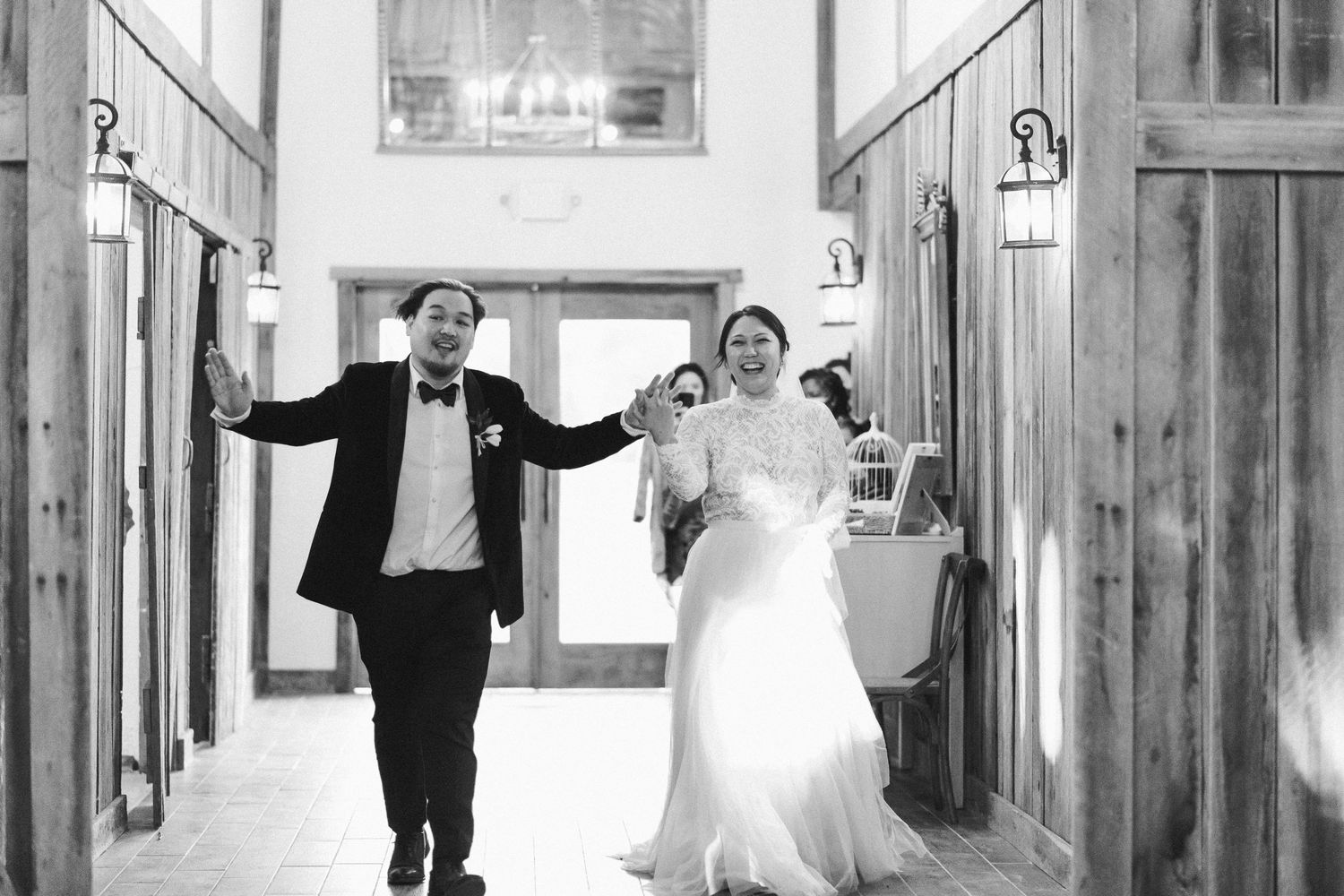 Bride and groom entering reception space at Great Marsh Estate