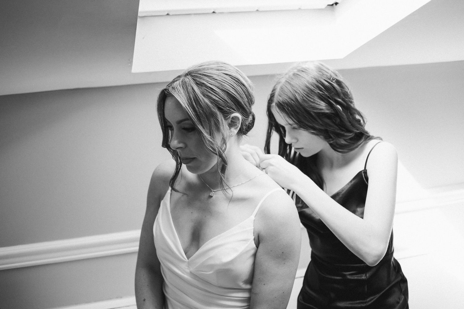 Niece helping the bride with necklace- Bull Run Winery, Centreville, Virginia
