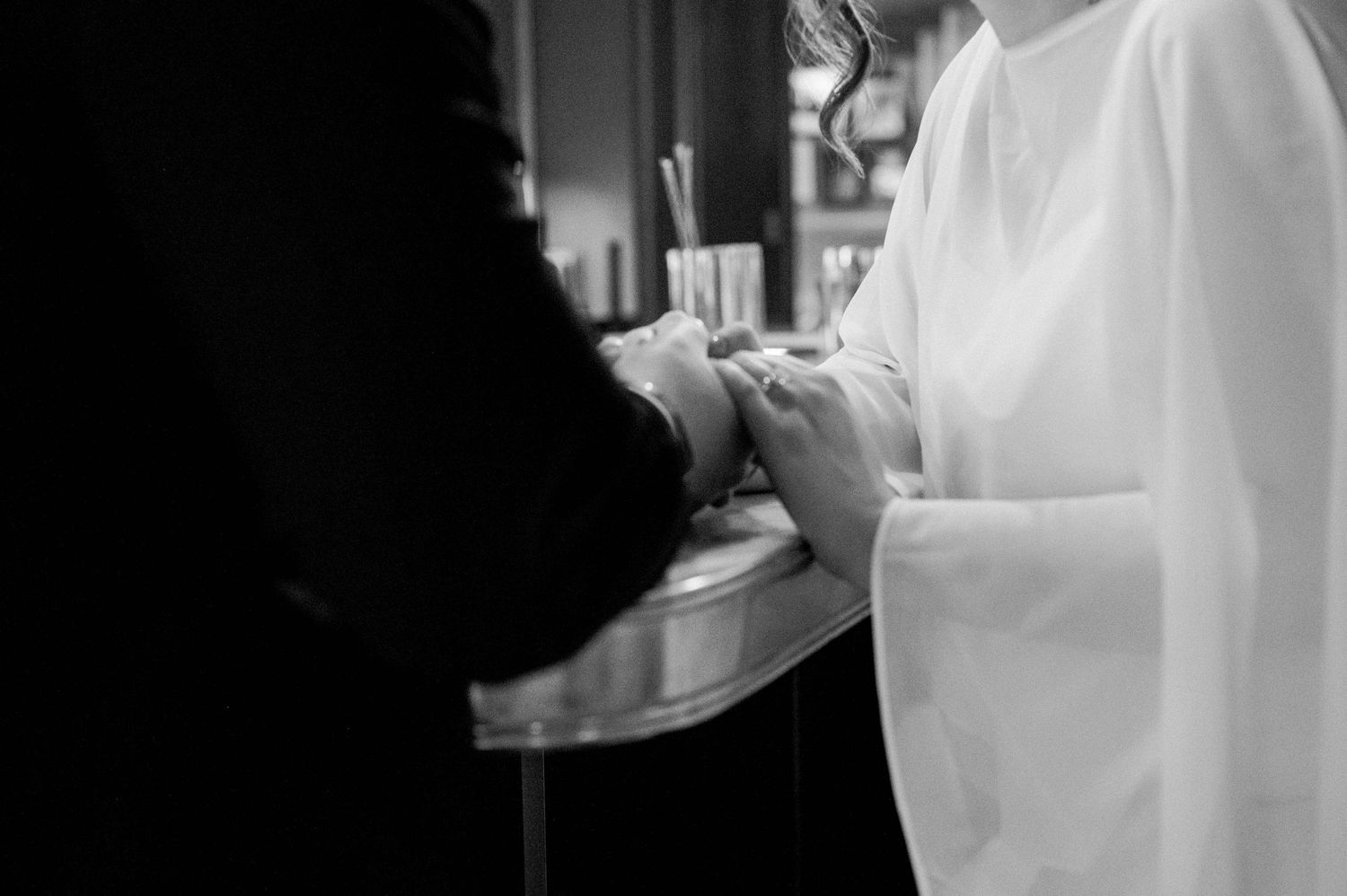 Bride and groom enjoying an intimate moment at the hotel bar.