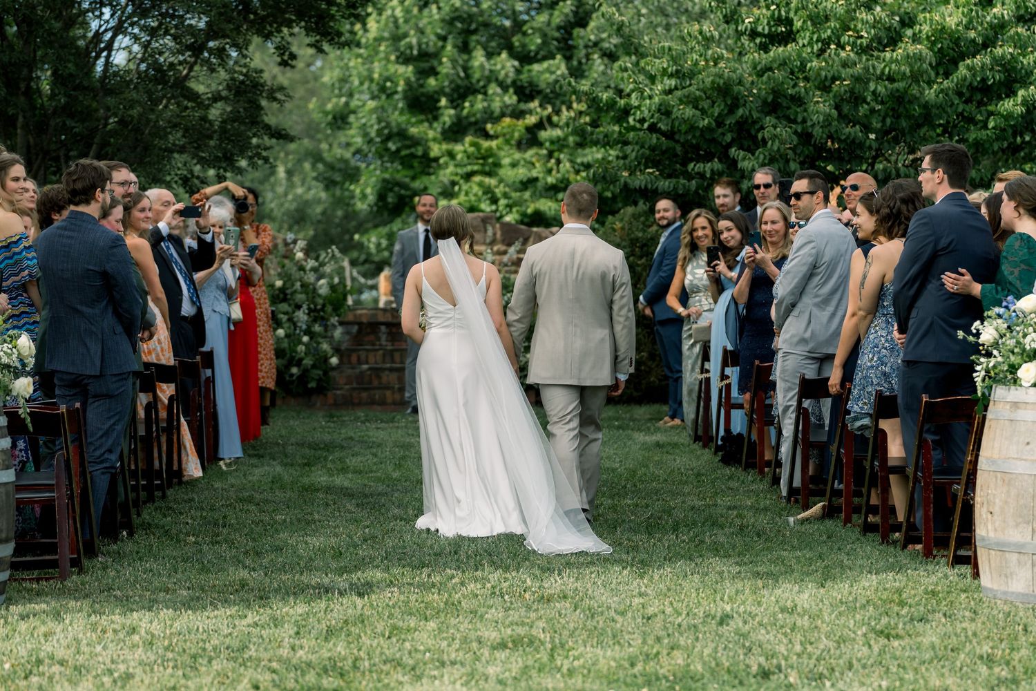 Bride and groom walking into ceremony- Bull Run Winery