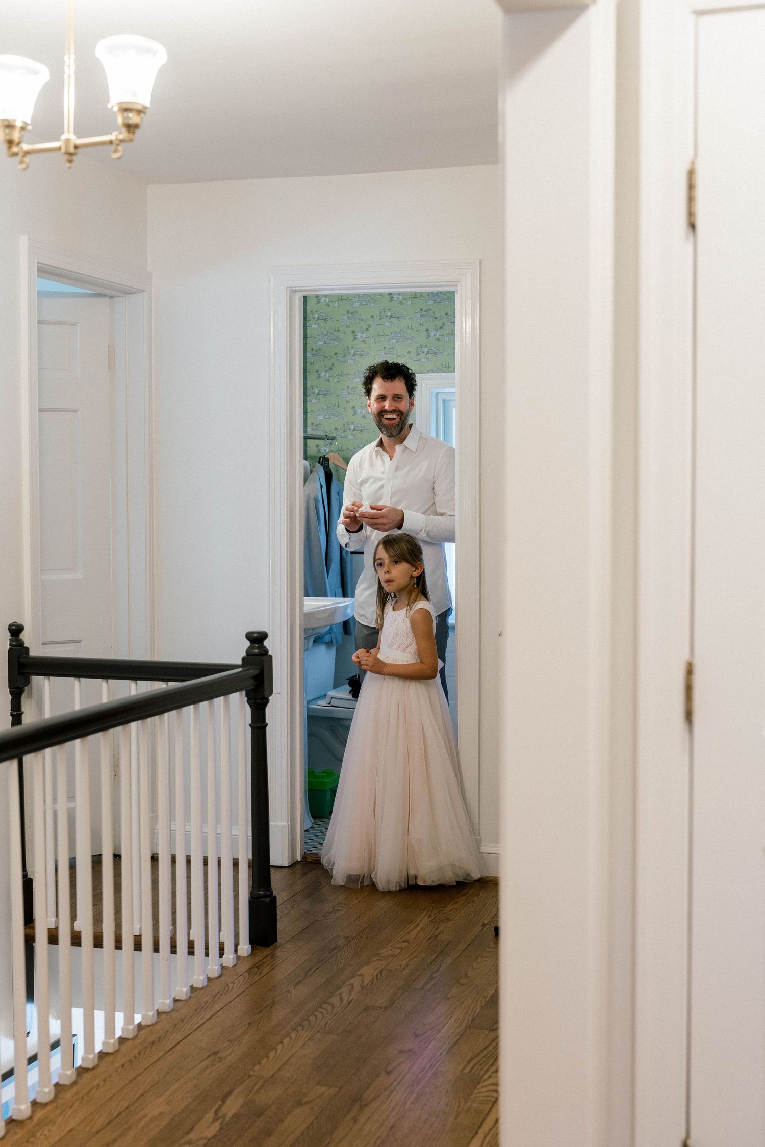 Groom getting ready with daughter.