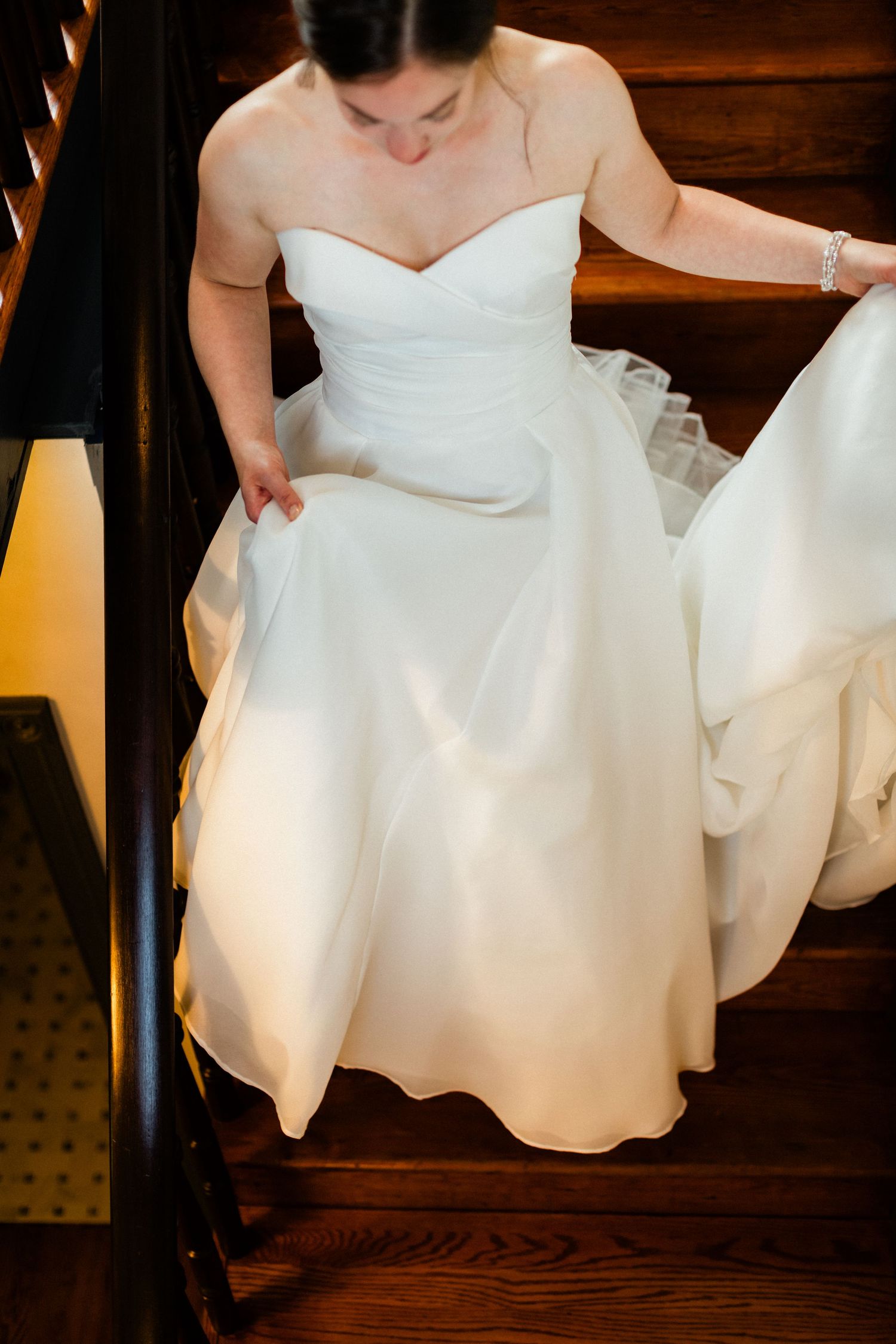 Bride walking down stairs at Old Farm Winery