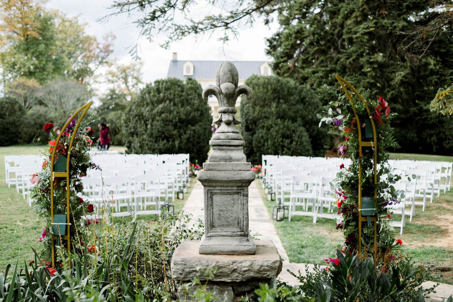 Rust Manor House concrete garden statue at wedding ceremony site in Leesburg, VA