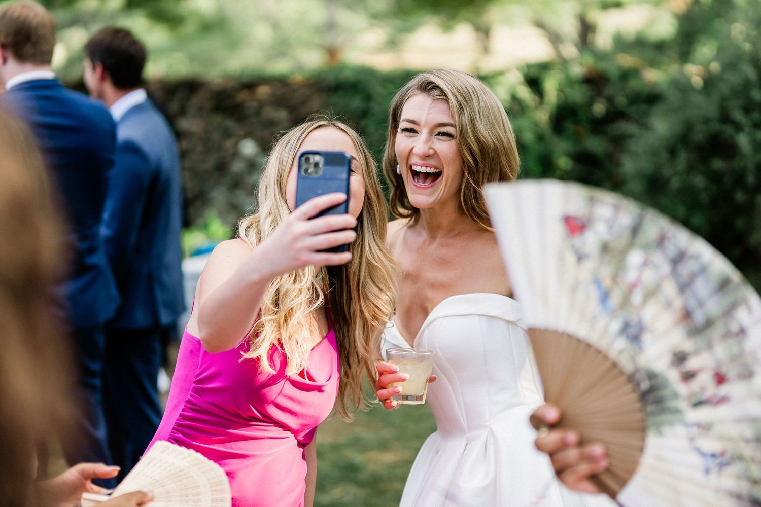 Bride taking a selfie with guest- Airlie gardens, Warrenton, Virginia