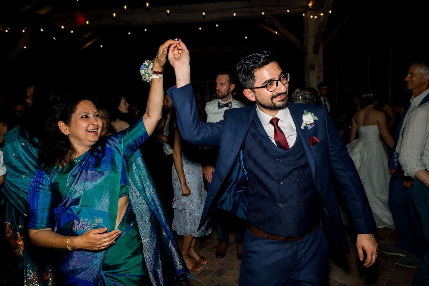 Groom and mom enjoying a dance-wedding reception held at Old Farm Winery at Hartland, Aldie, Virginia