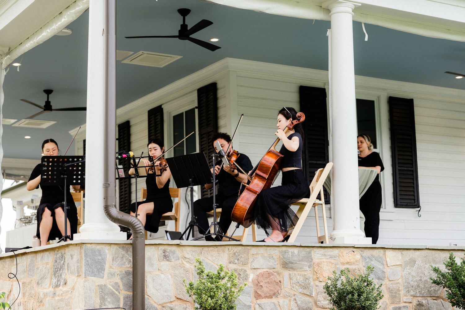 Mini orchestra/live music playing during wedding ceremony at Old Farm Winery at Hartland.