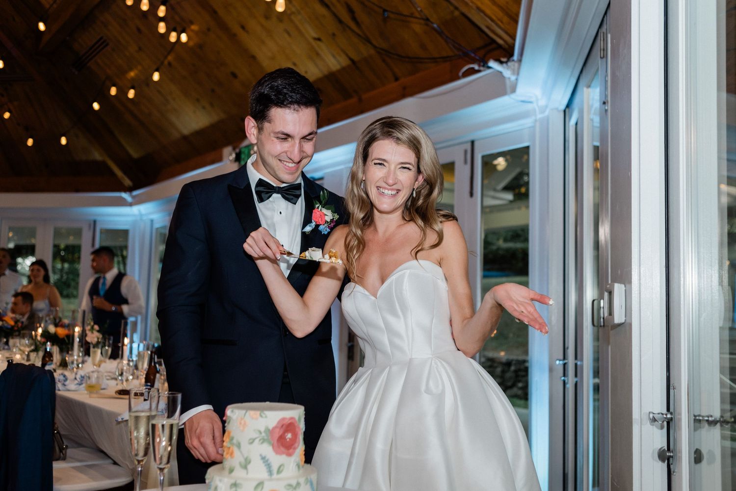 Couple cutting into their wedding cake- Airlie, Warrenton, Virginia
