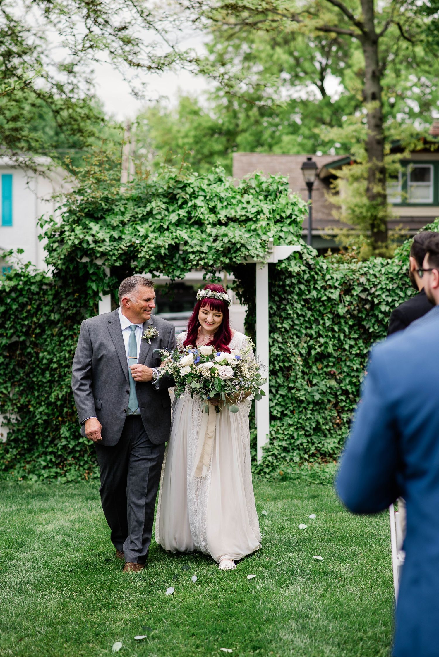 A bride and her father coming down the aisle at the Vandiver Inn, Havre De Grace, Maryland.