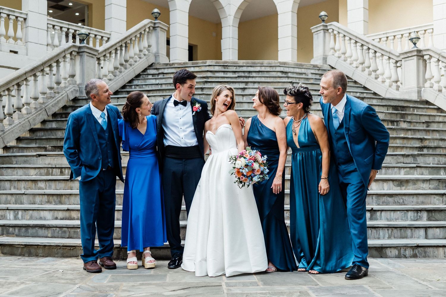 Family portrait in front of the steps at Airlie- Wedding venue in Warrenton, Virginia