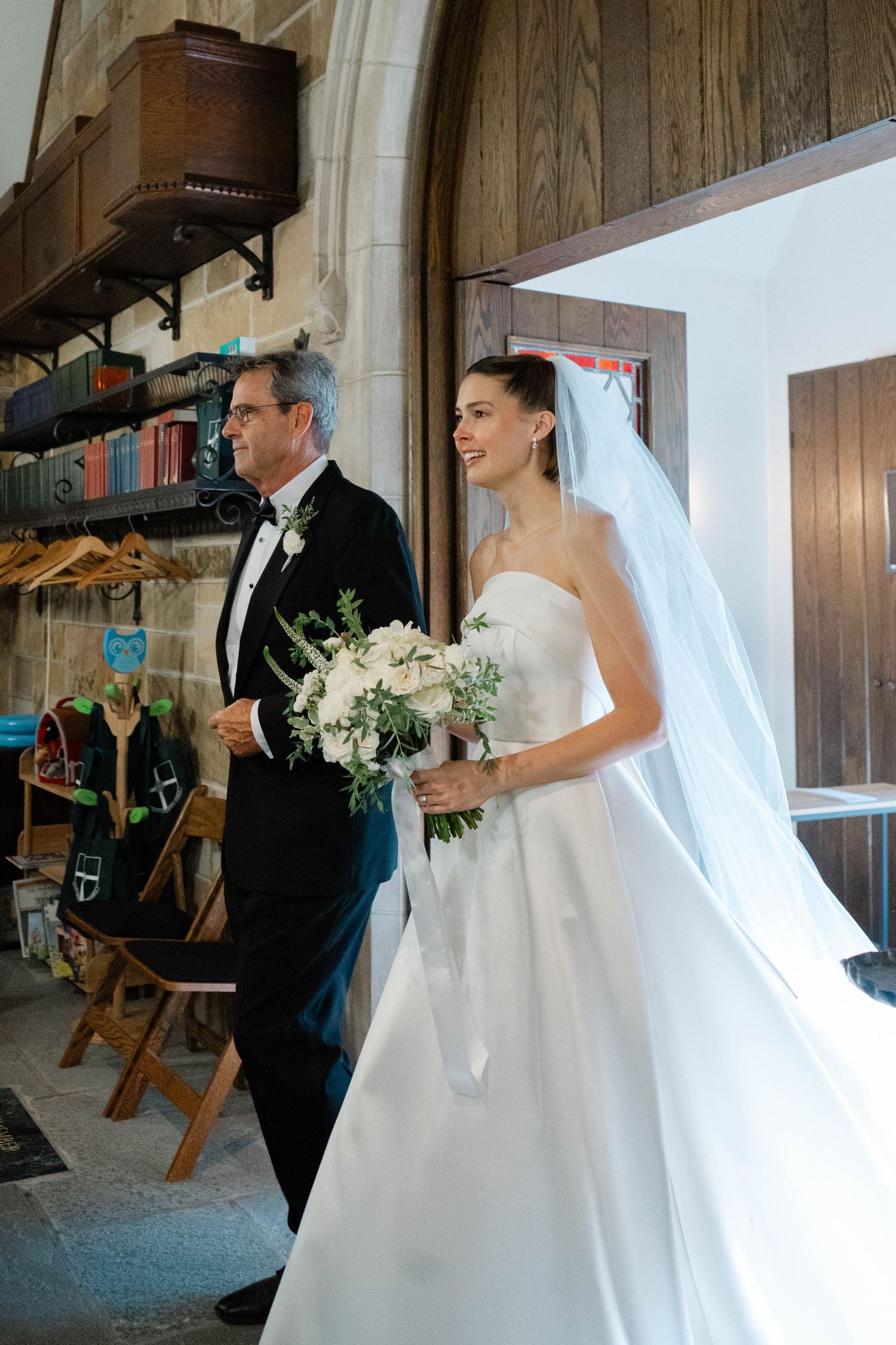 Bride and father walking into church wedding in NW DC