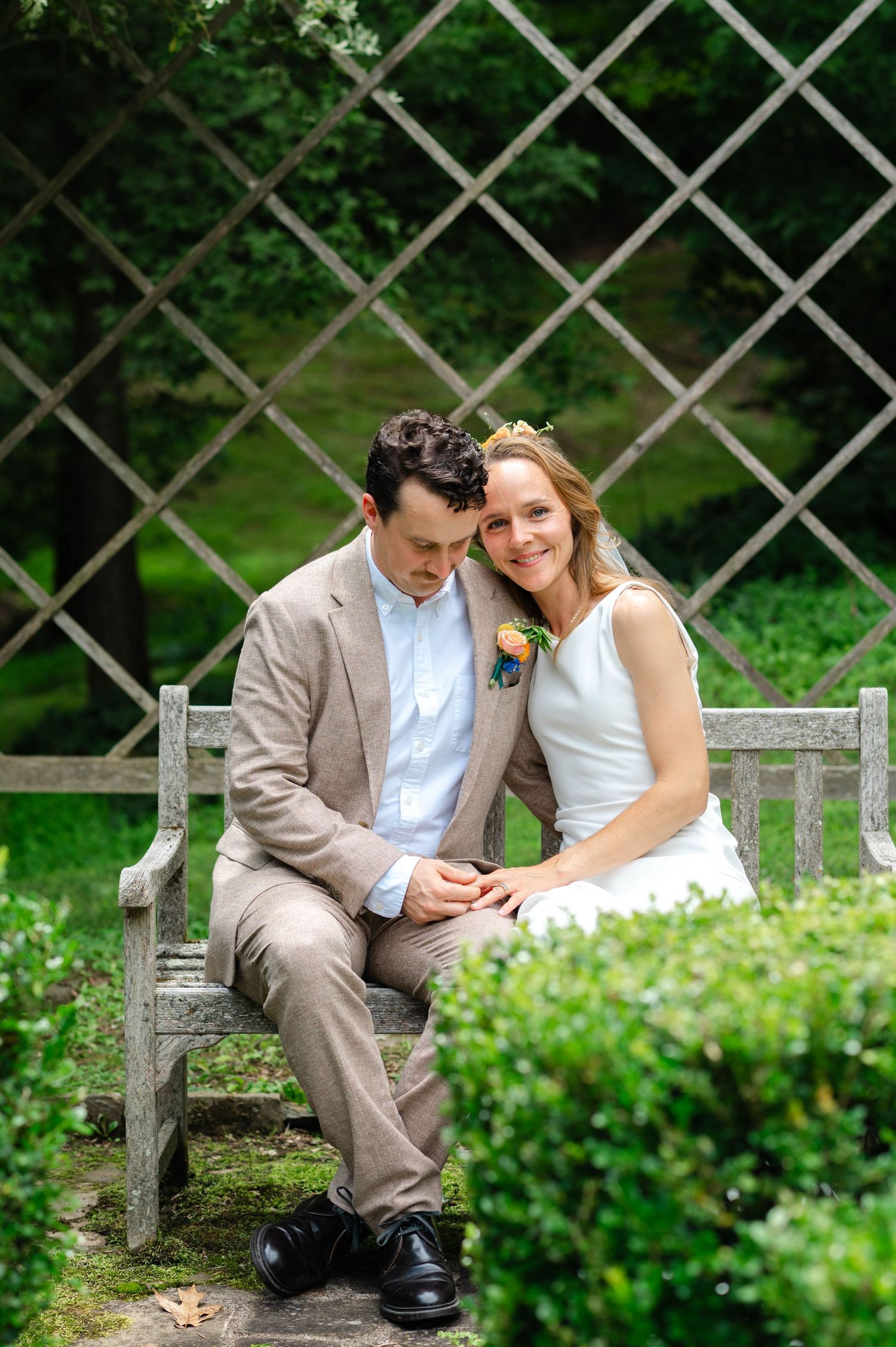 A couple sitting on a bench together at Chancellor's Rock Farm in Flint Hill, Virginia.