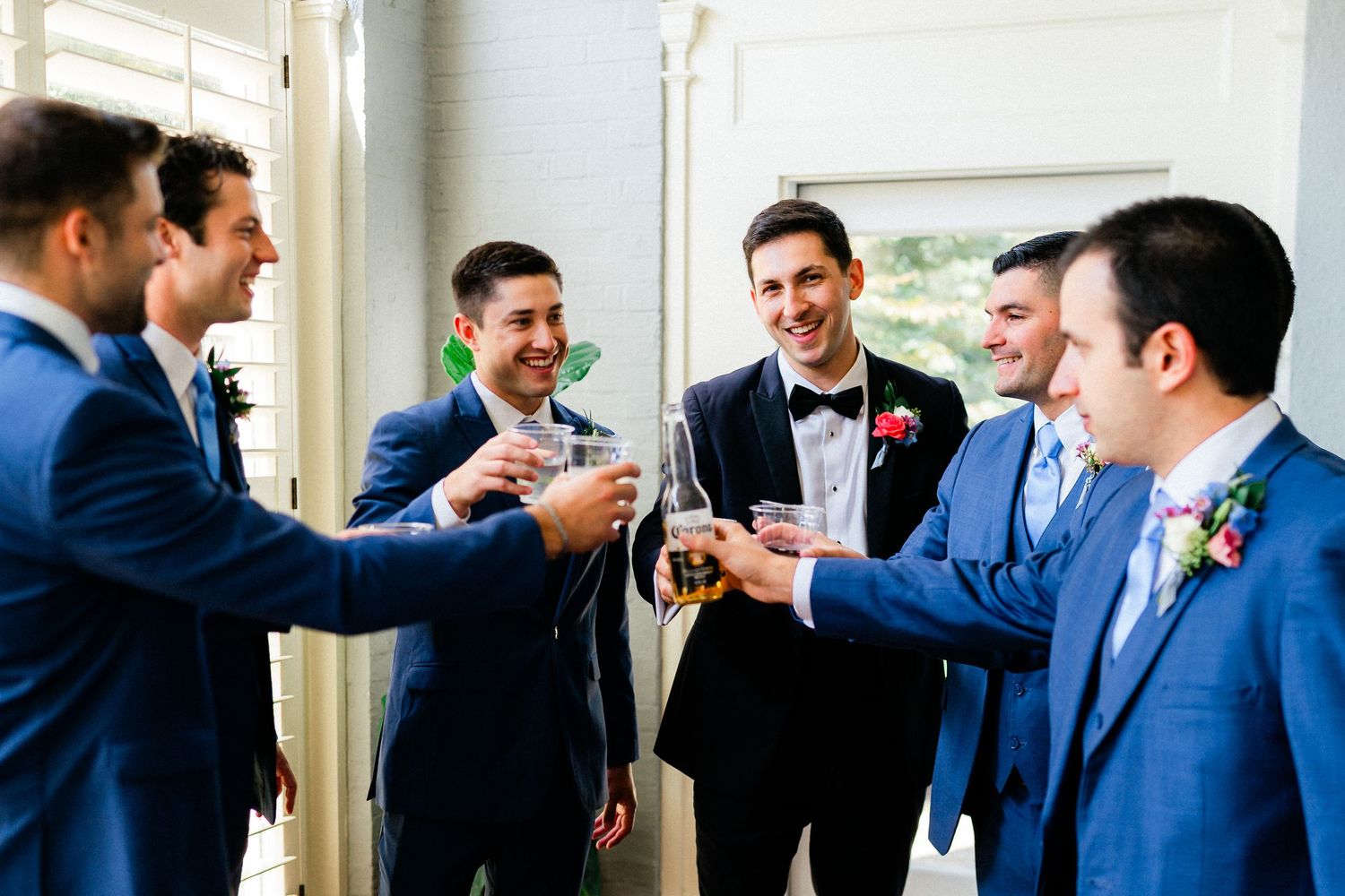 Groom with his groomsmen sharing a toast- Airlie, Warrenton, Virginia