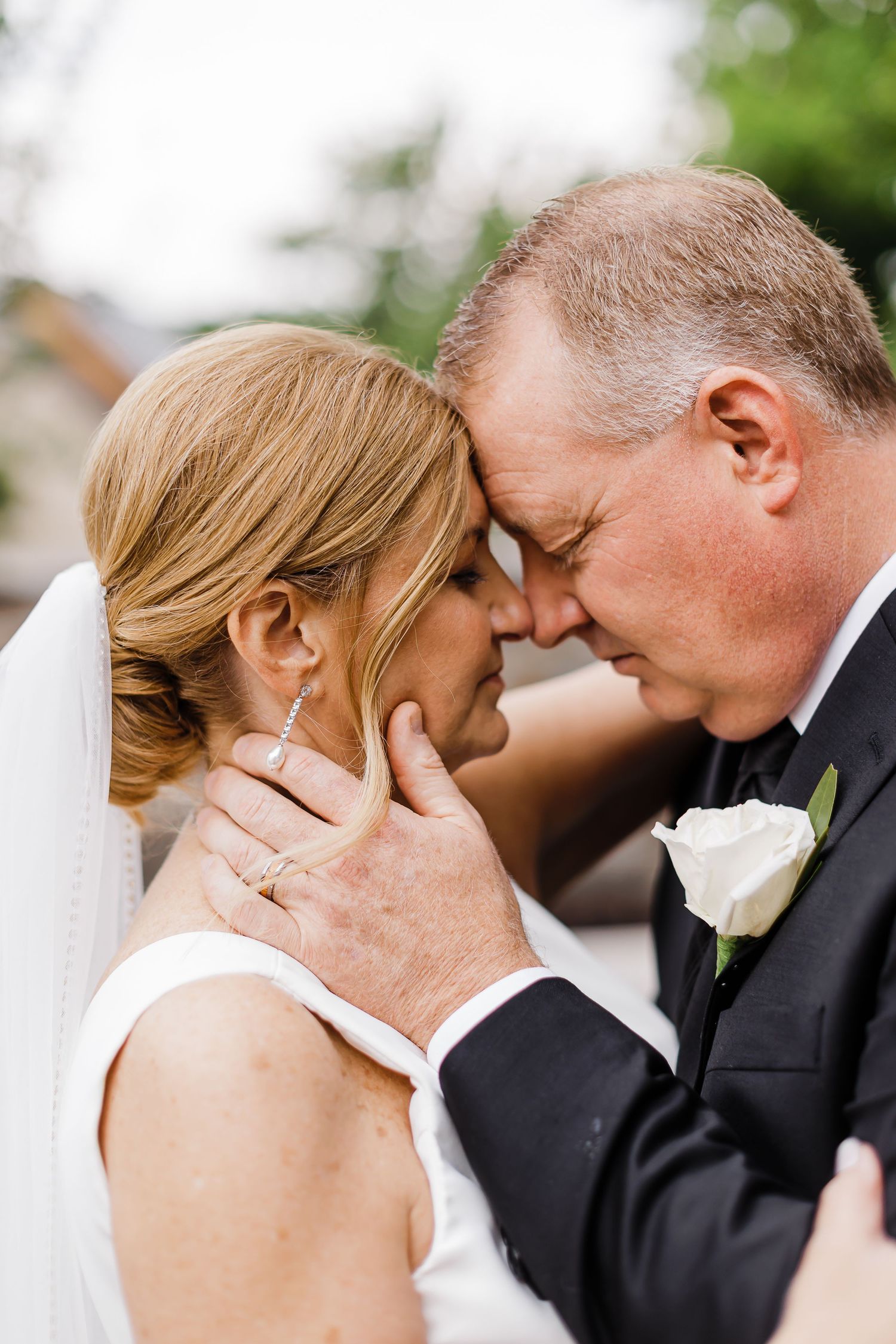 Close-up wedding portraits capturing romantic moments between the couple.