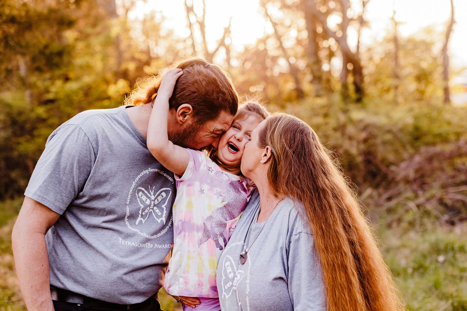 A couple sharing romantic moments together in a sunlit outdoor setting.