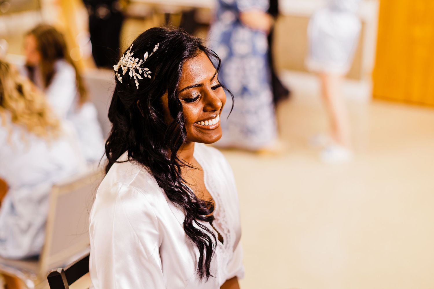 Getting ready moments captured in warm lighting before the wedding ceremony.