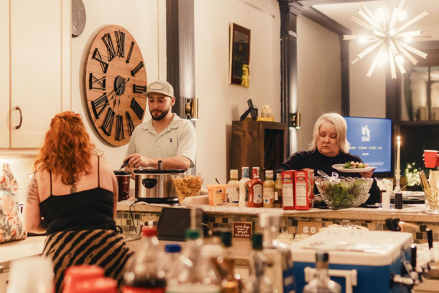A cozy restaurant interior with wooden tables and vintage decor including a large wall clock.
