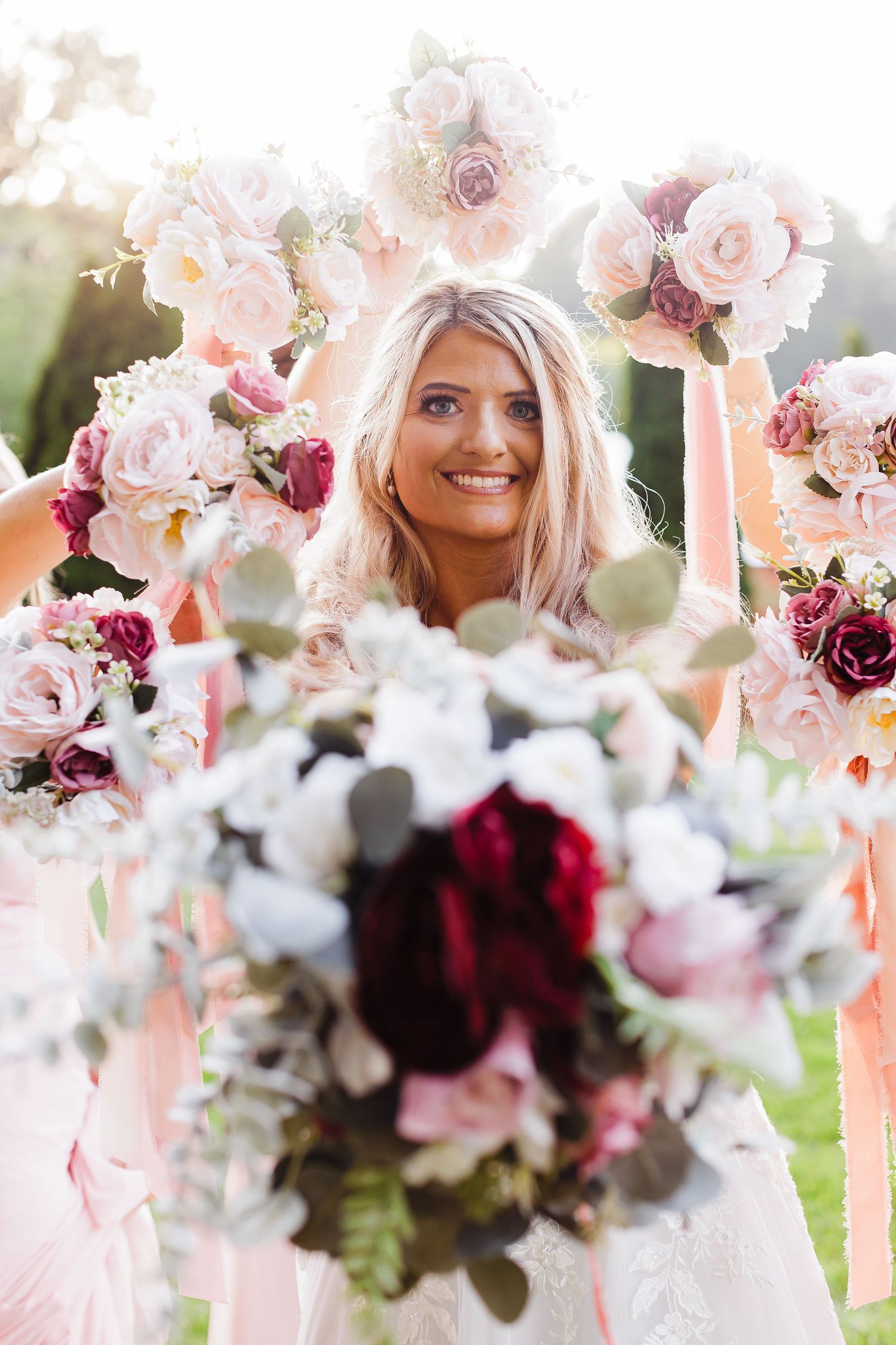 Romantic wedding bouquets featuring pink and burgundy flowers with delicate arrangements.