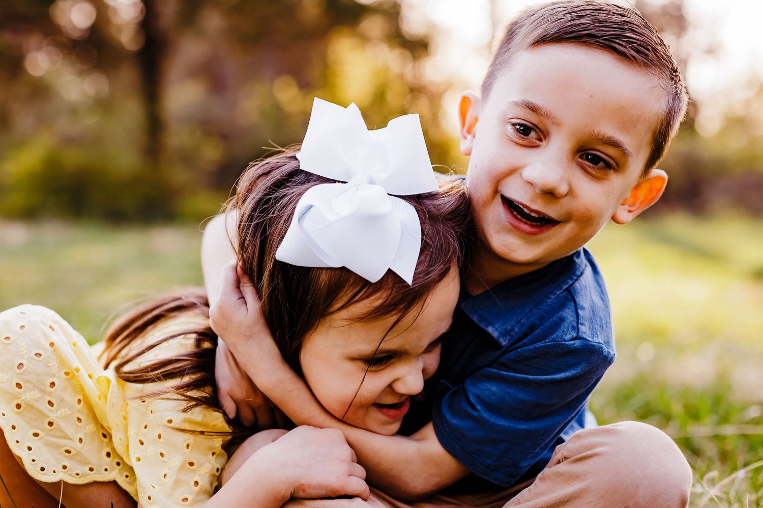 Candid family moments captured during an outdoor photo session.