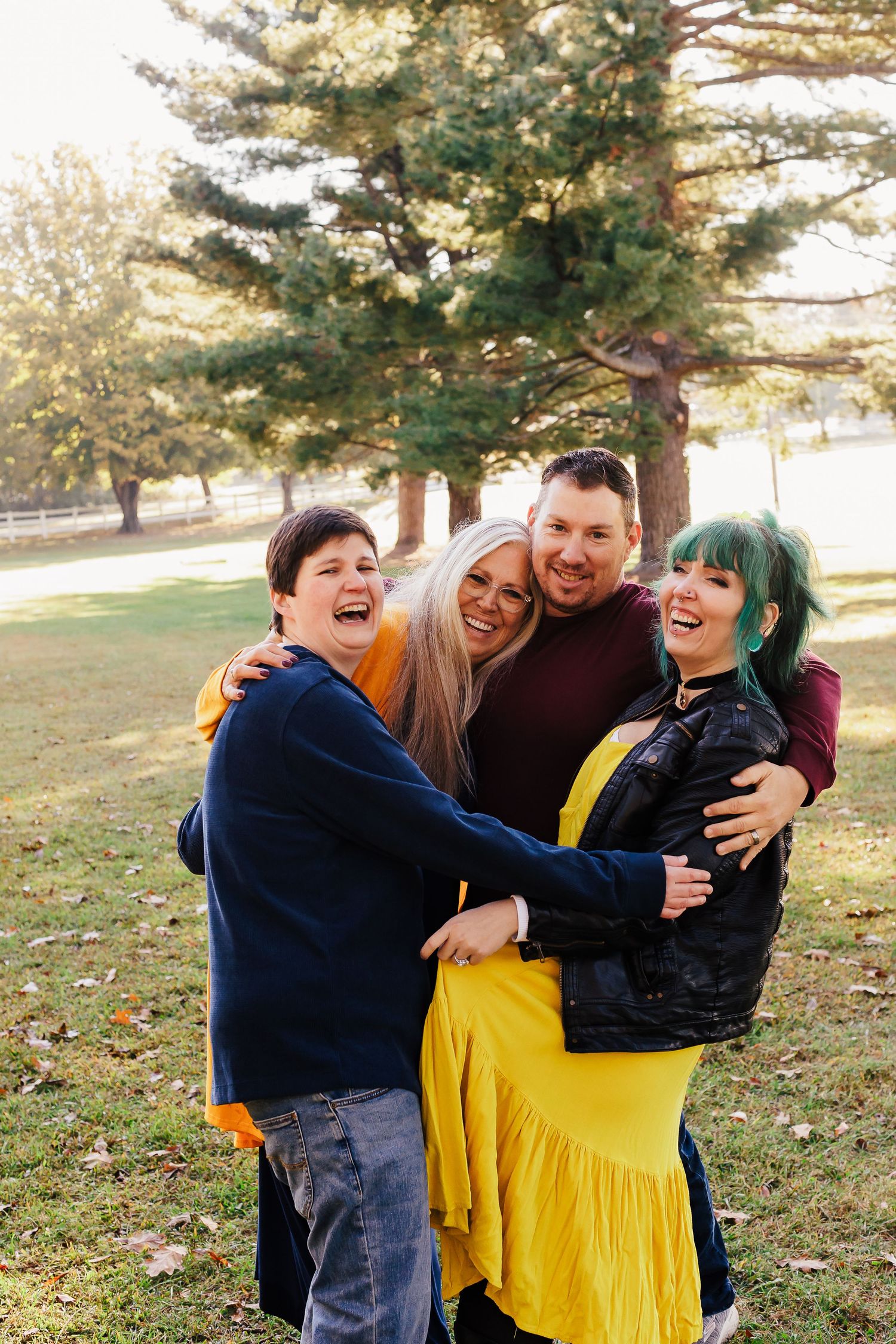 Candid group shots of friends laughing and hugging in a park setting.