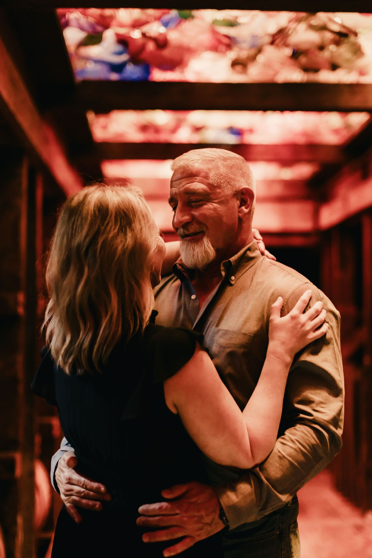 Intimate dance moment captured in warm lighting at an indoor venue.